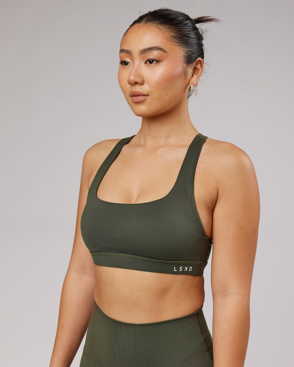 Model wearing Base Sports Bra - Forest Night