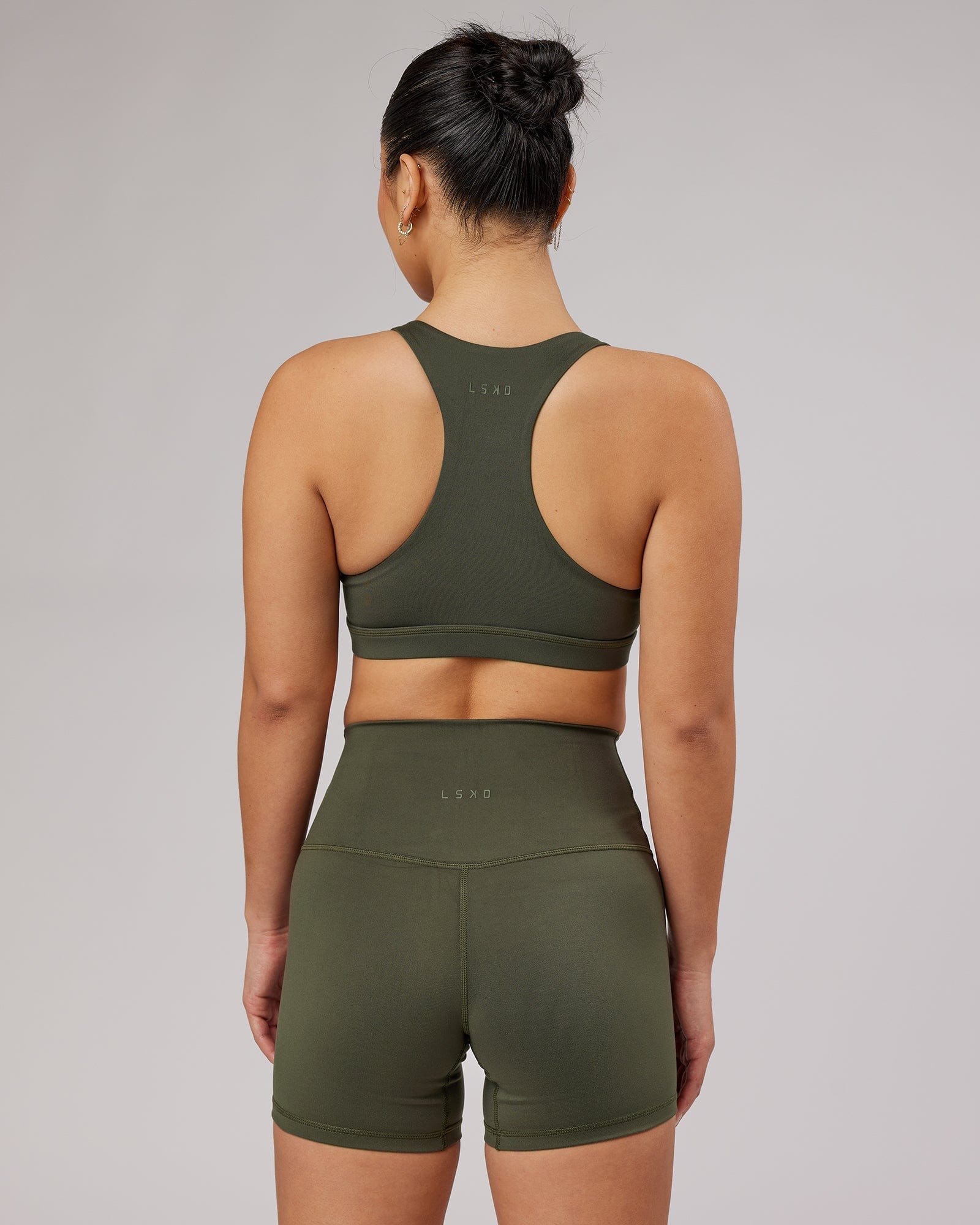 Model wearing Base Sports Bra - Forest Night