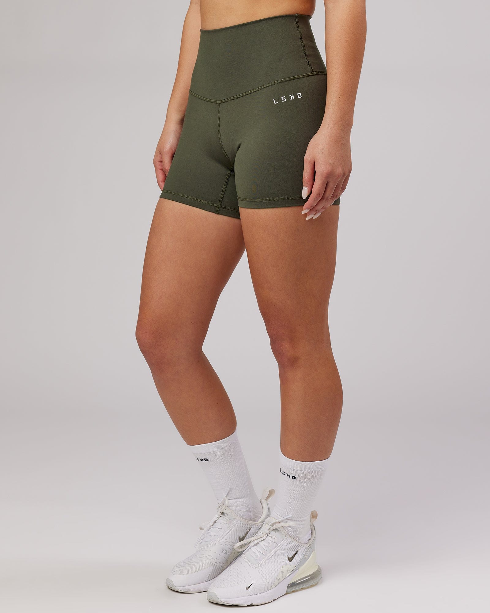 Model wearing Base X-Short Tight - Forest Night