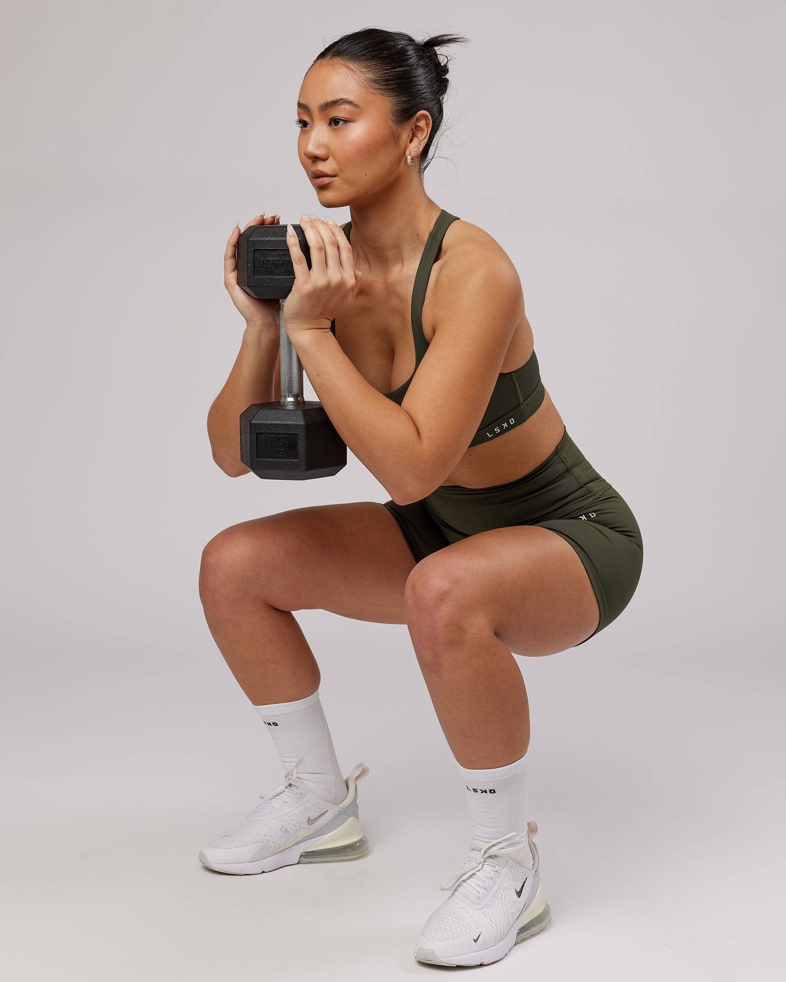 Model wearing Base X-Short Tight - Forest Night