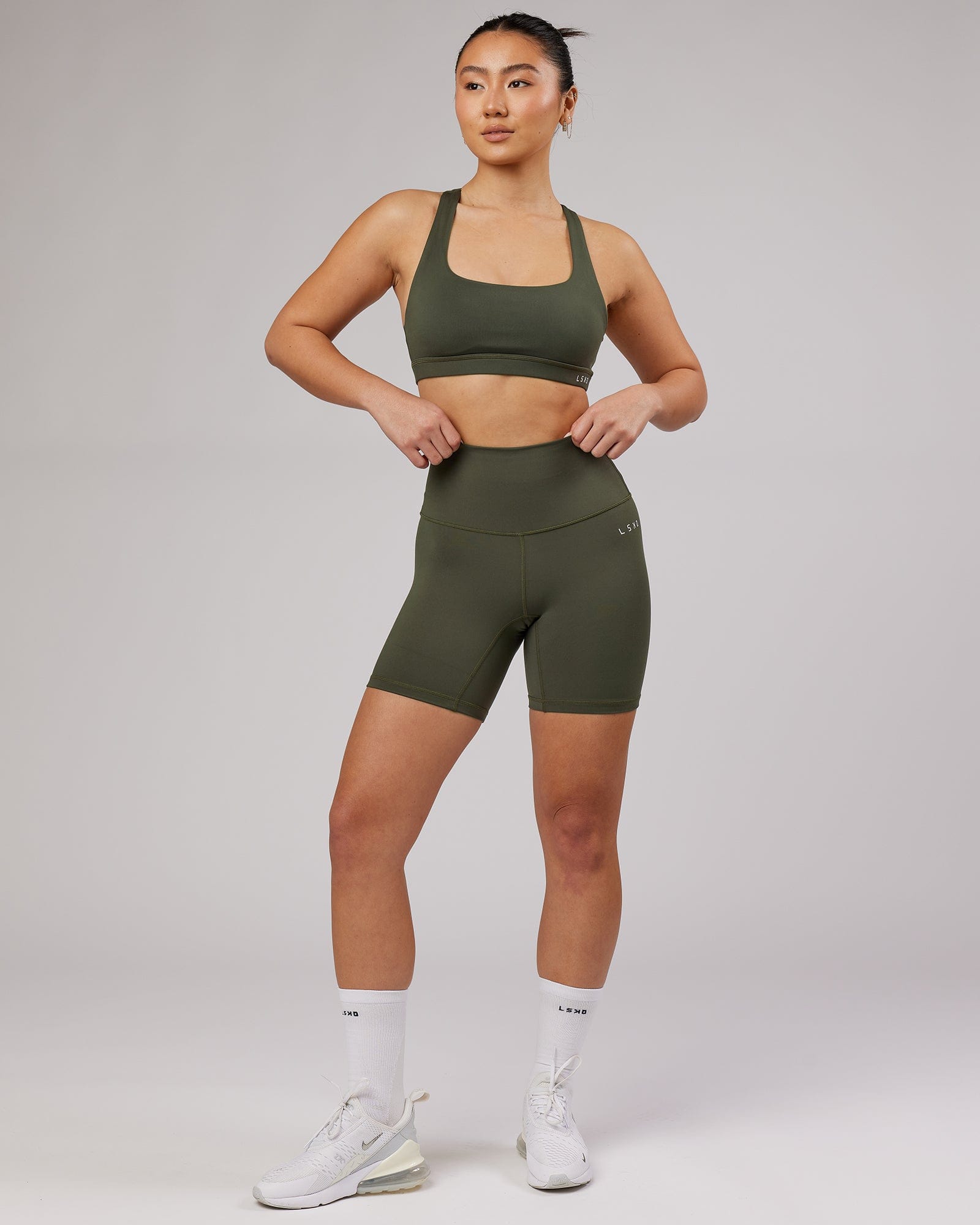 Model wearing Base Mid Short Tight - Forest Night