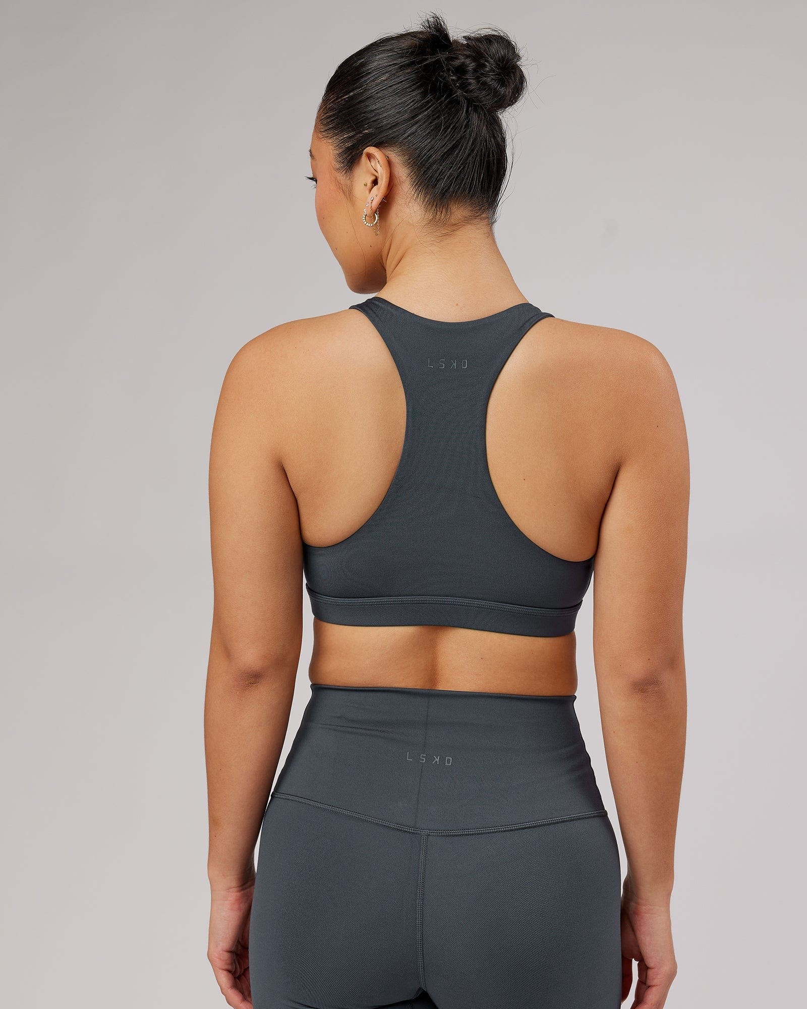 Model wearing Base Sports Bra - Ink