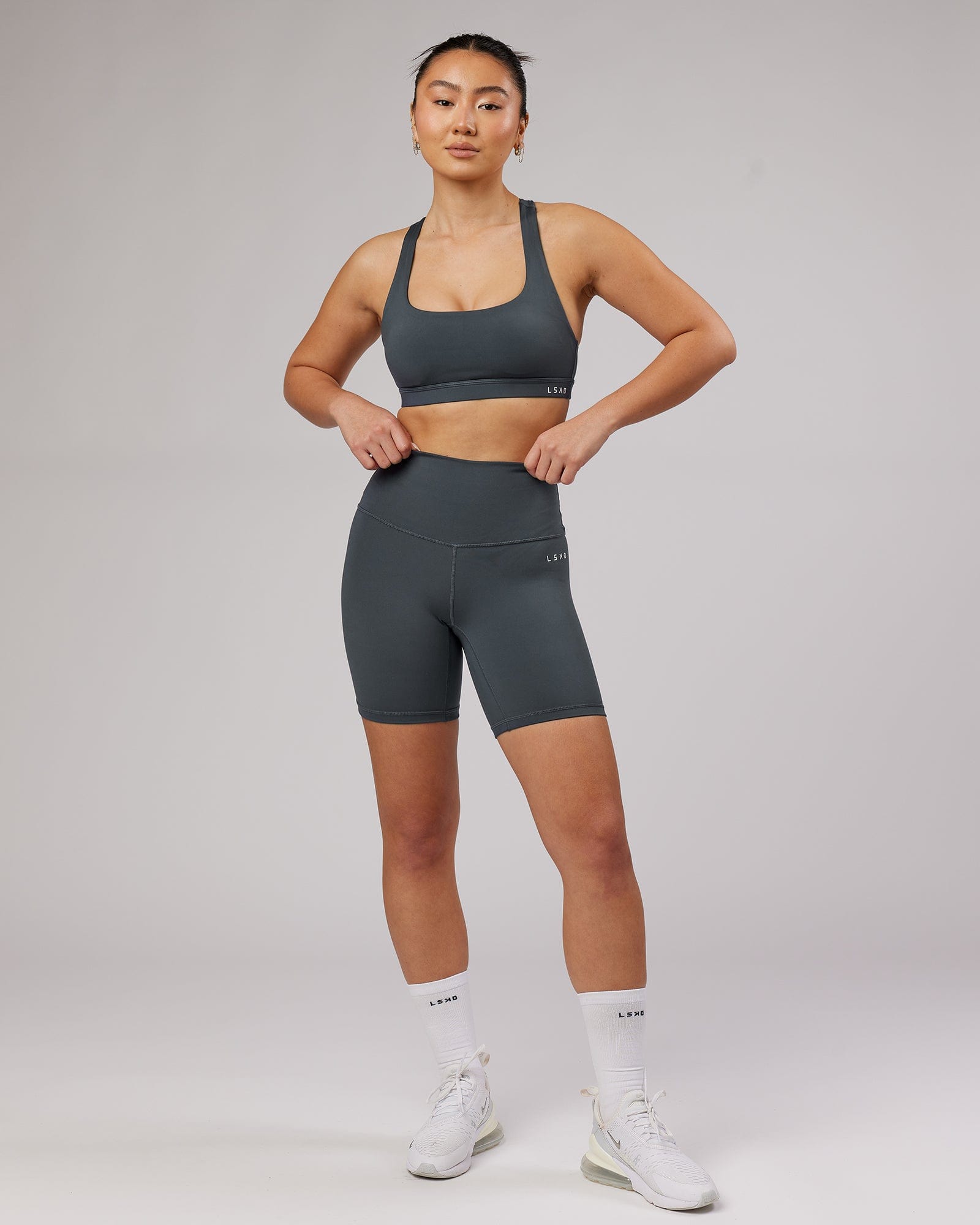 Model wearing Base Mid Short Tight - Ink