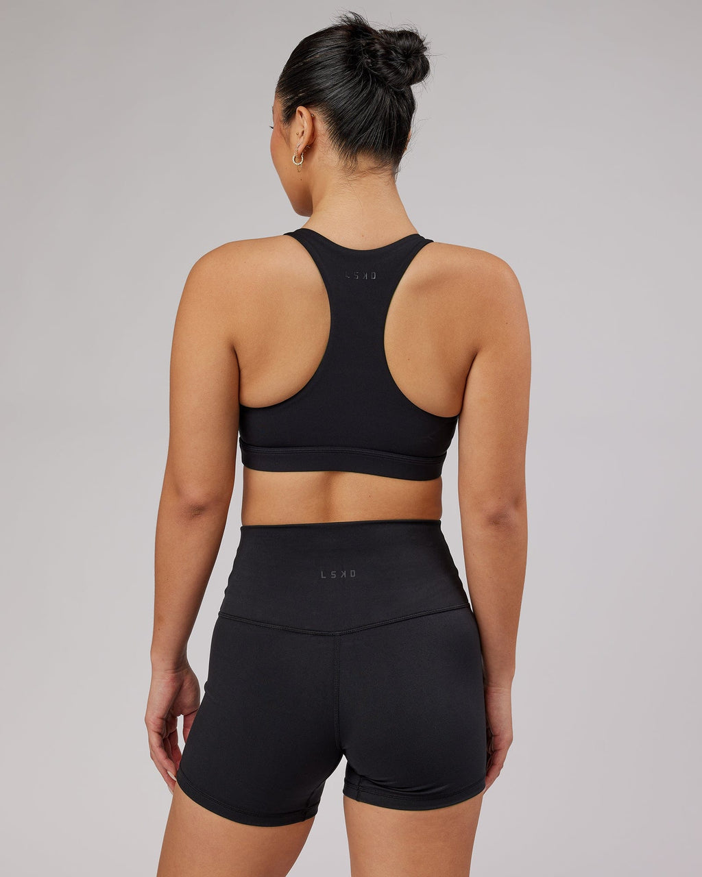 Model wearing Base Sports Bra - Black