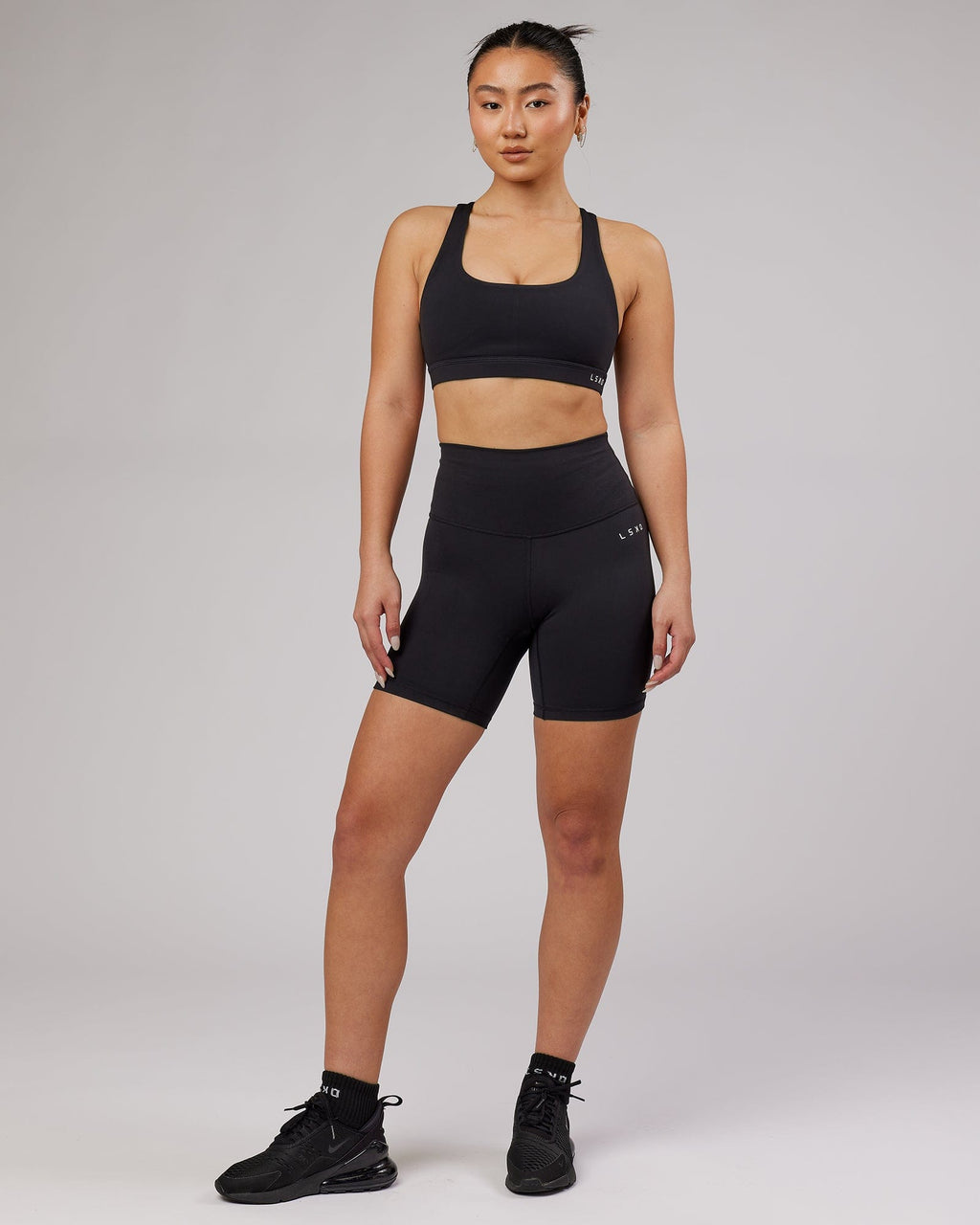 Model wearing Base Mid Short Tight - Black