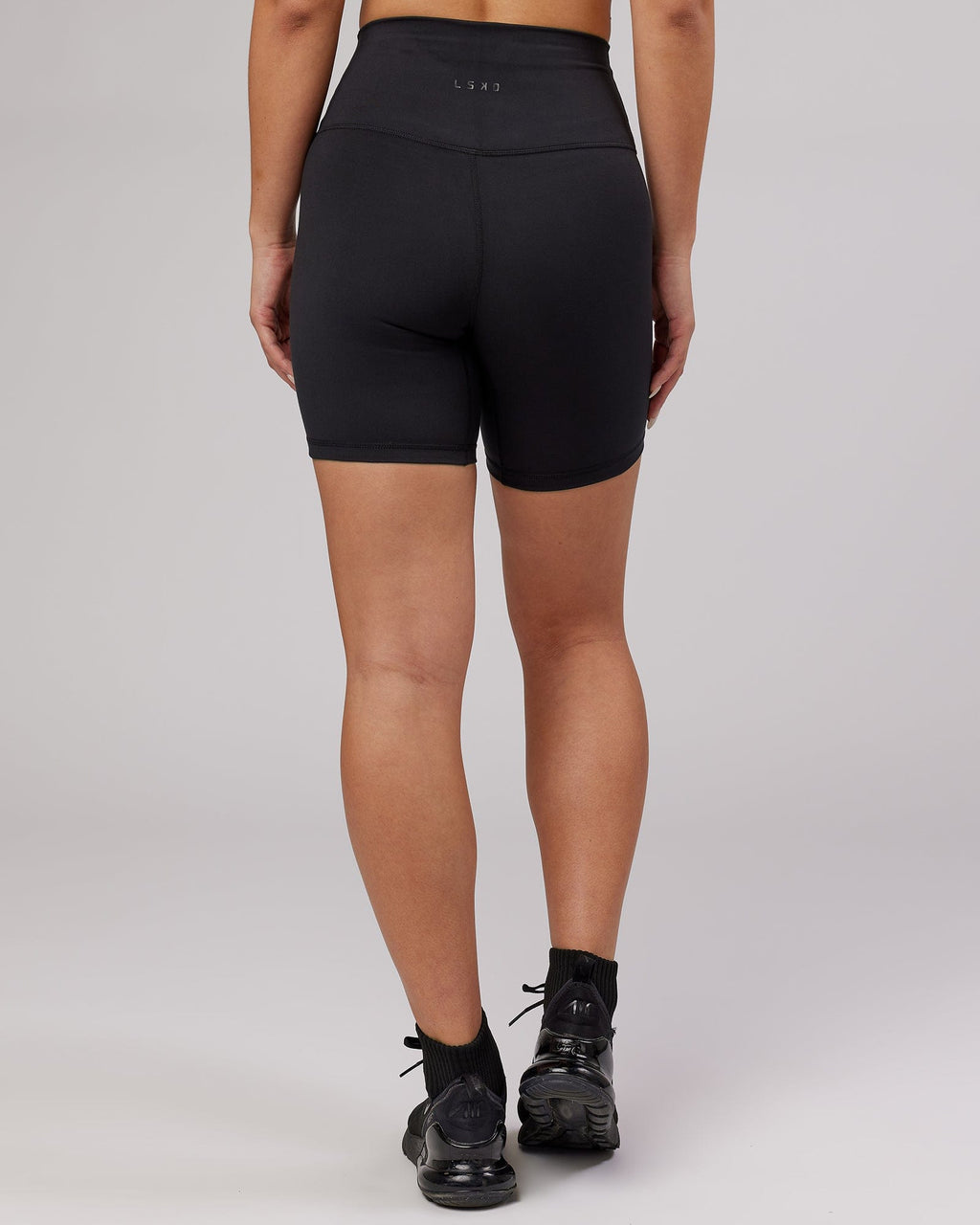 Model wearing Base Mid Short Tight - Black
