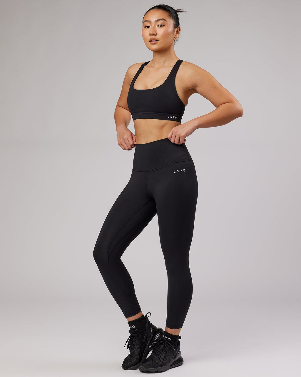 Model wearing Base 7/8 Length Tight - Black