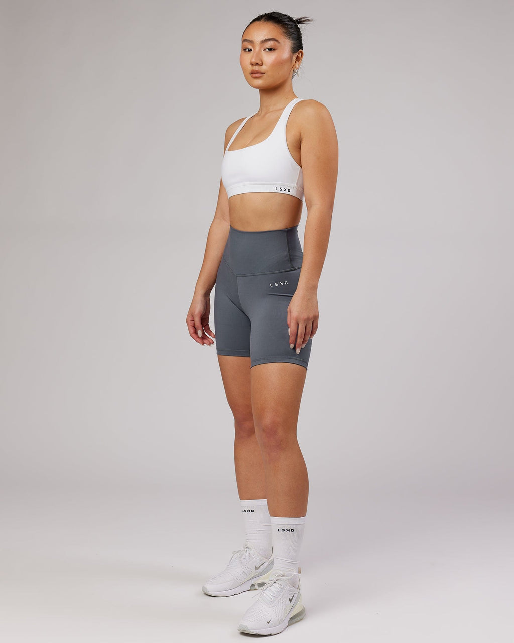 Model wearing Base Sports Bra - White