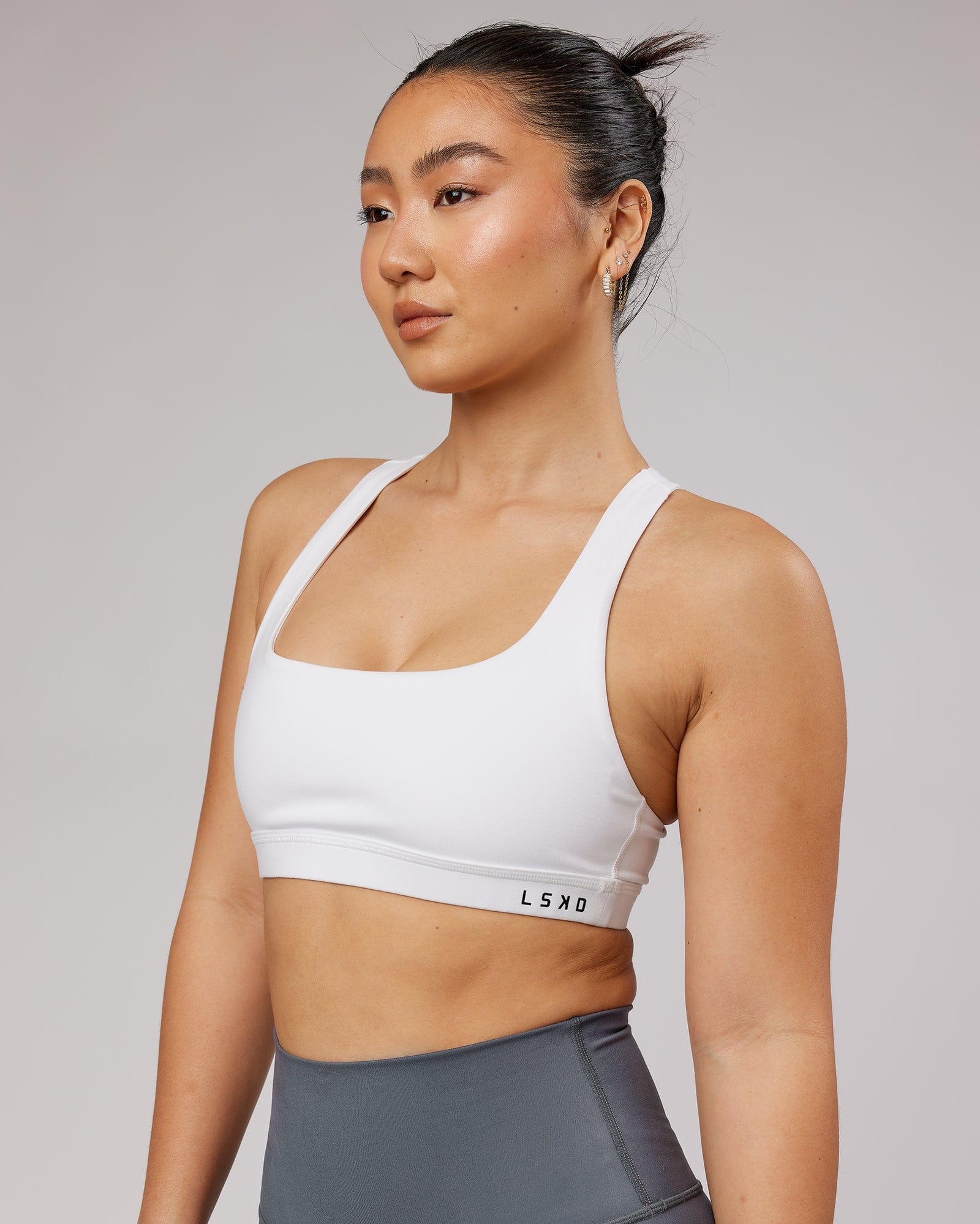 Model wearing Base Sports Bra - White