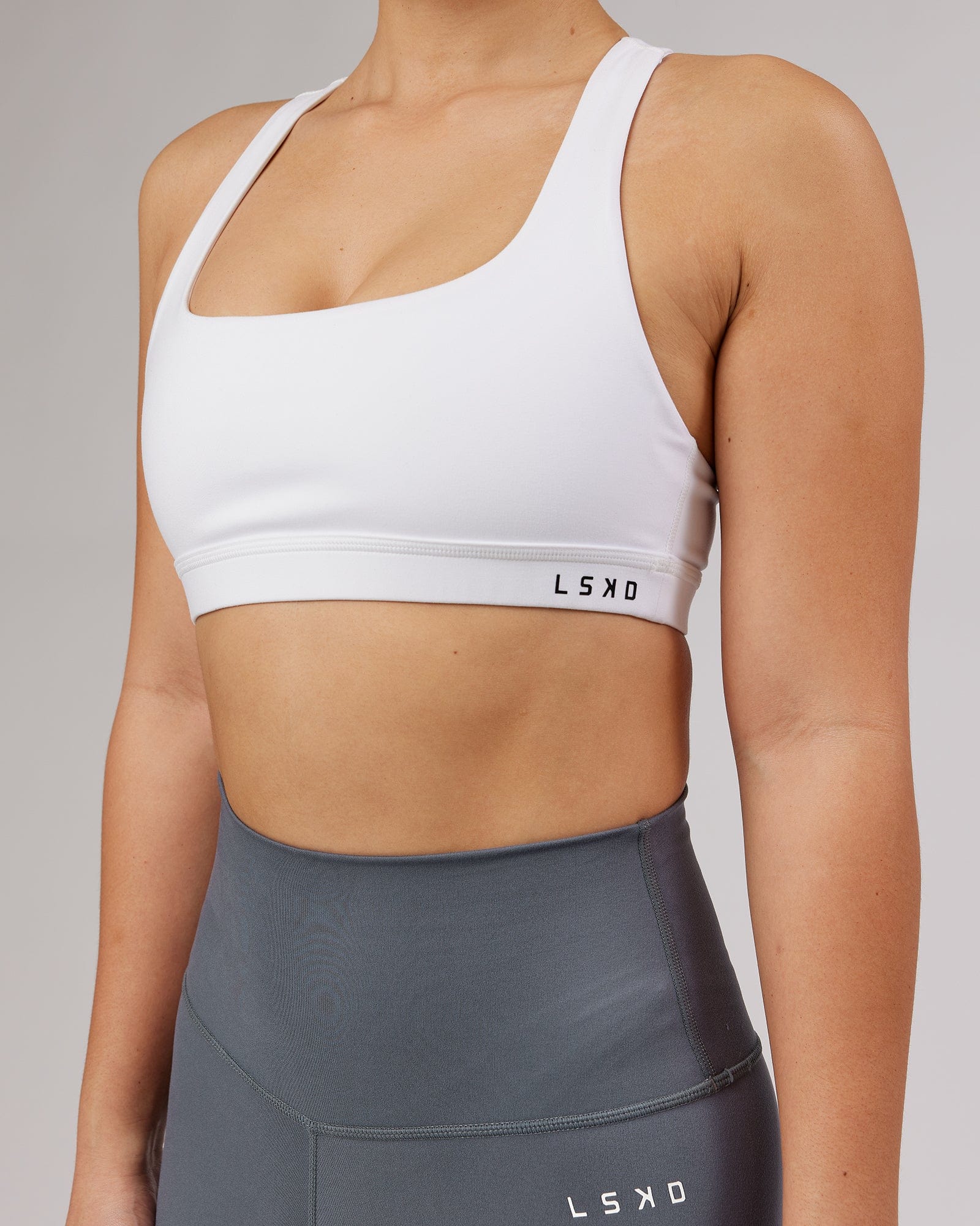 Model wearing Base Sports Bra - White