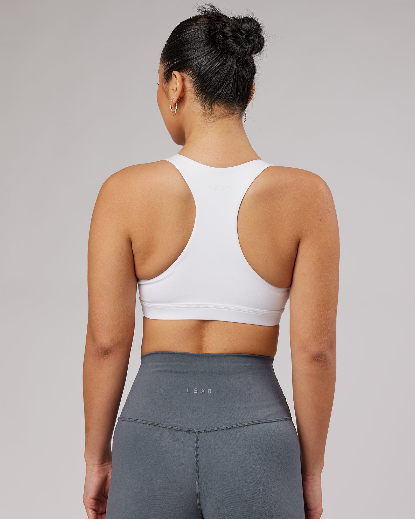 Model wearing Base Sports Bra - White