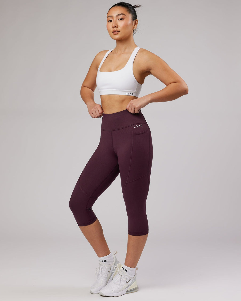 Model wearing Rep 3/4 Length Tight Small Logo - Wine