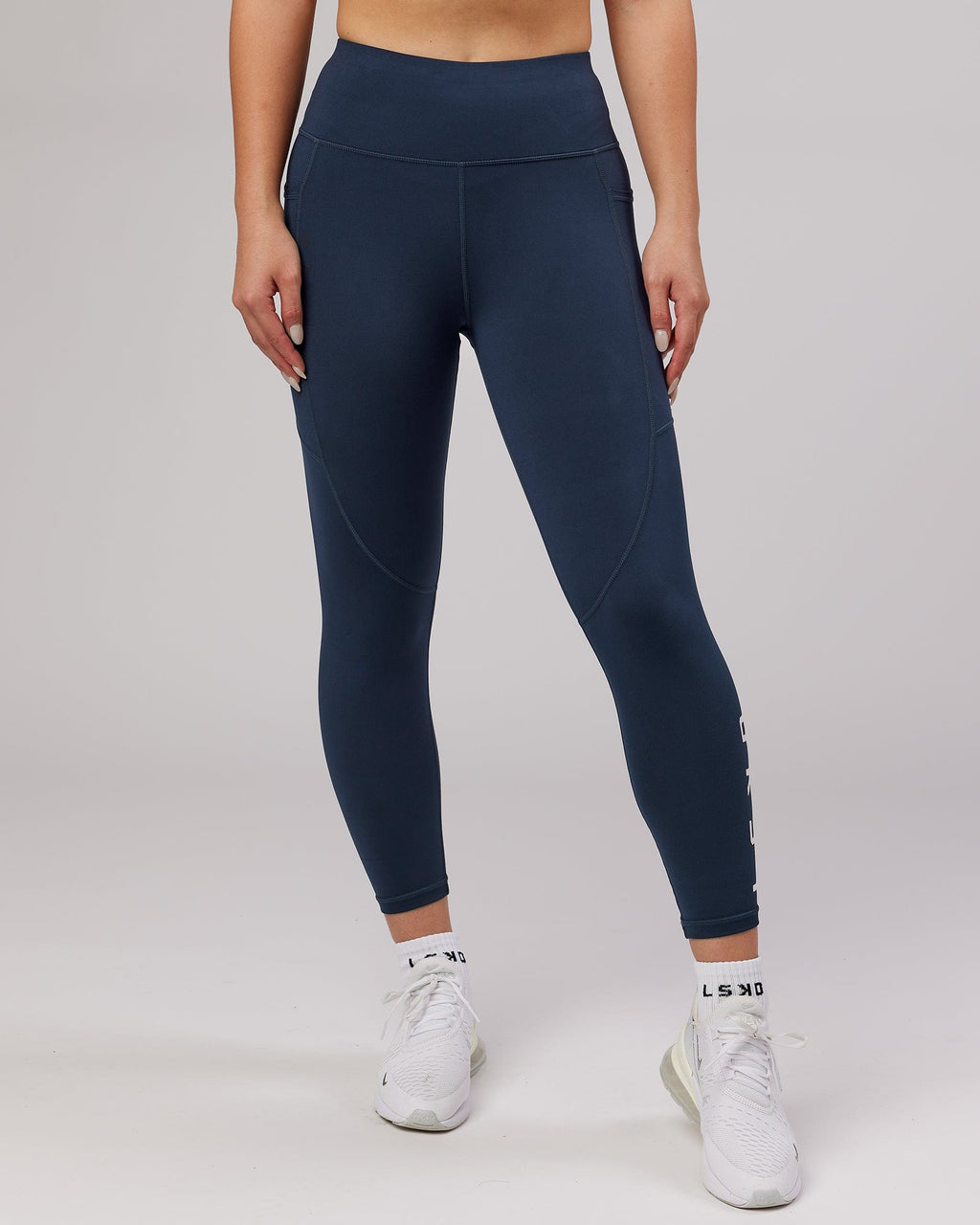 Model wearing Rep 7/8 Length Tight - Navy