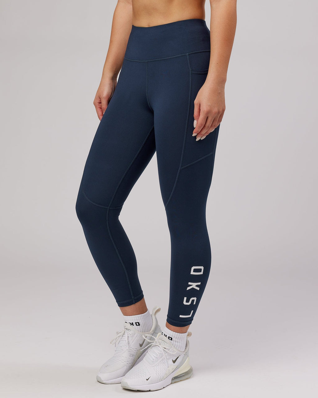 Model wearing Rep 7/8 Length Tight - Navy