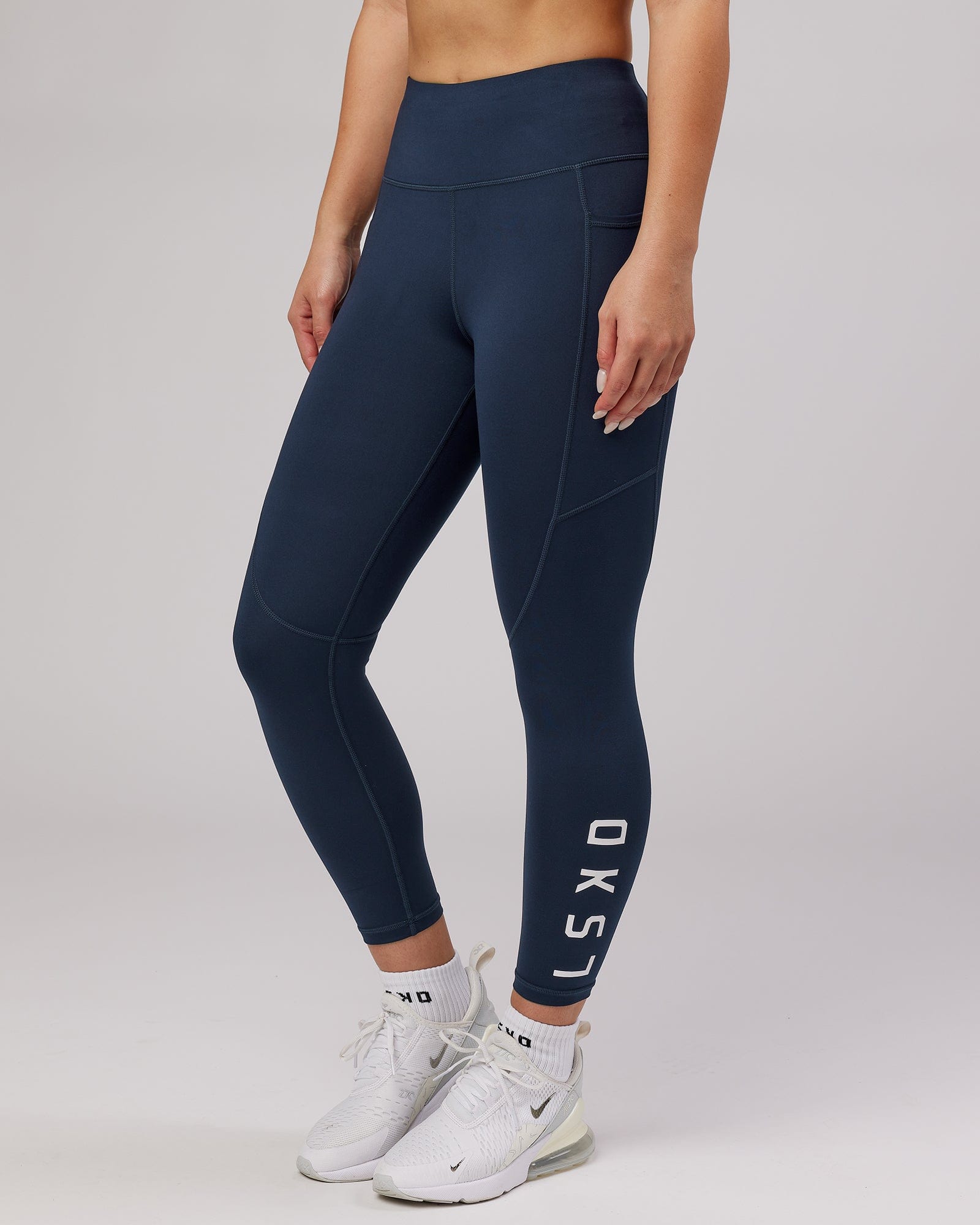 Model wearing Rep 7/8 Length Tight - Navy