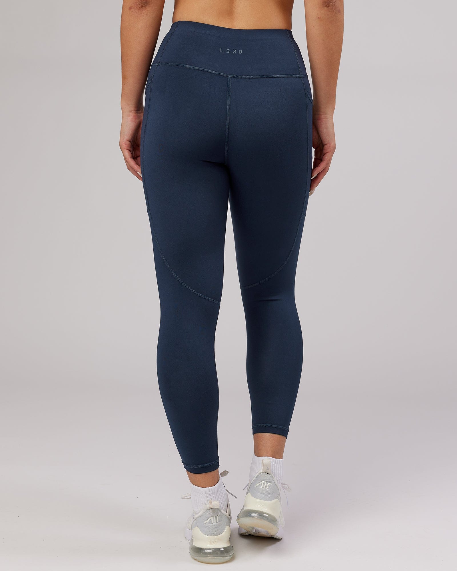 Model wearing Rep 7/8 Length Tight - Navy