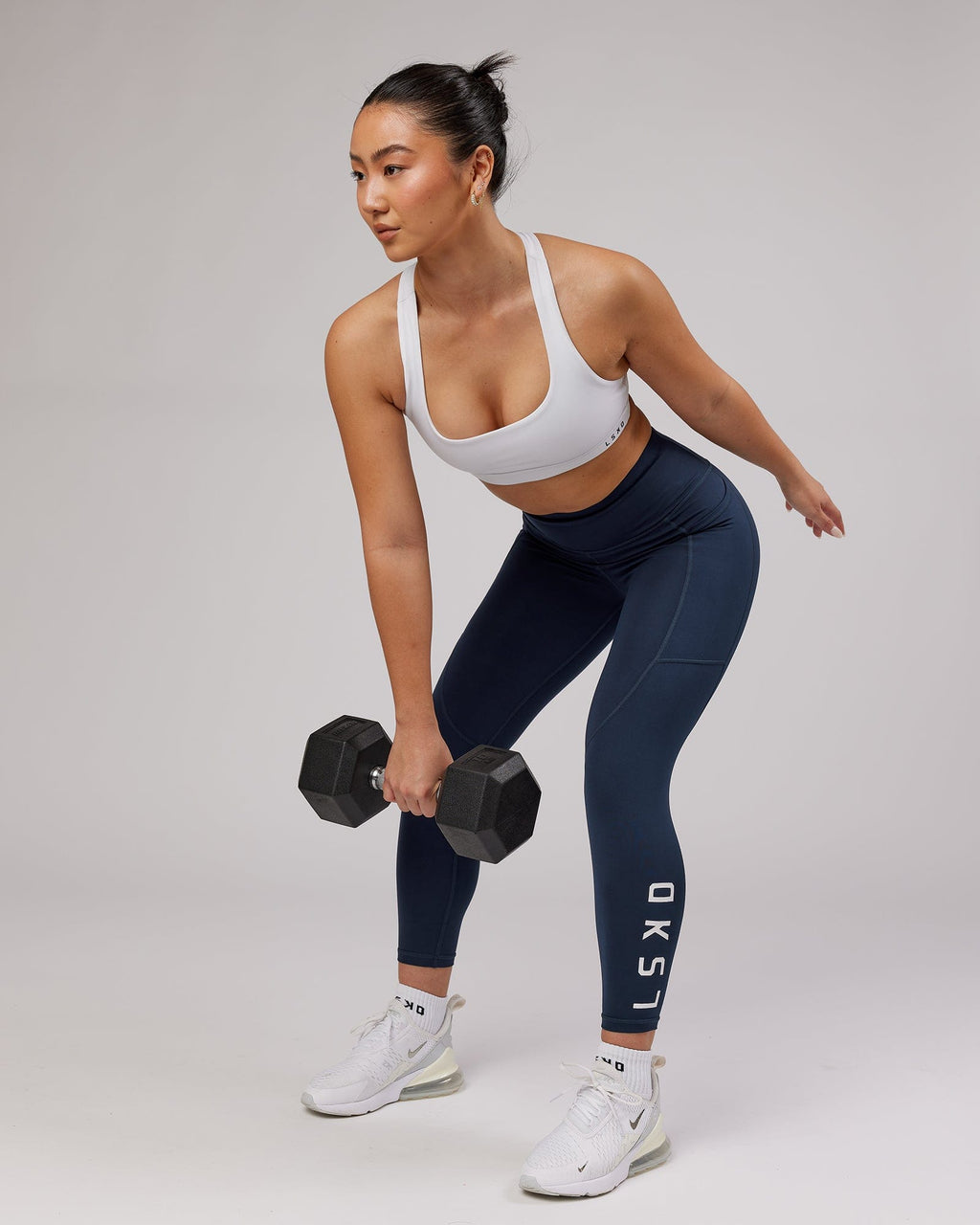 Model wearing Rep 7/8 Length Tight - Navy