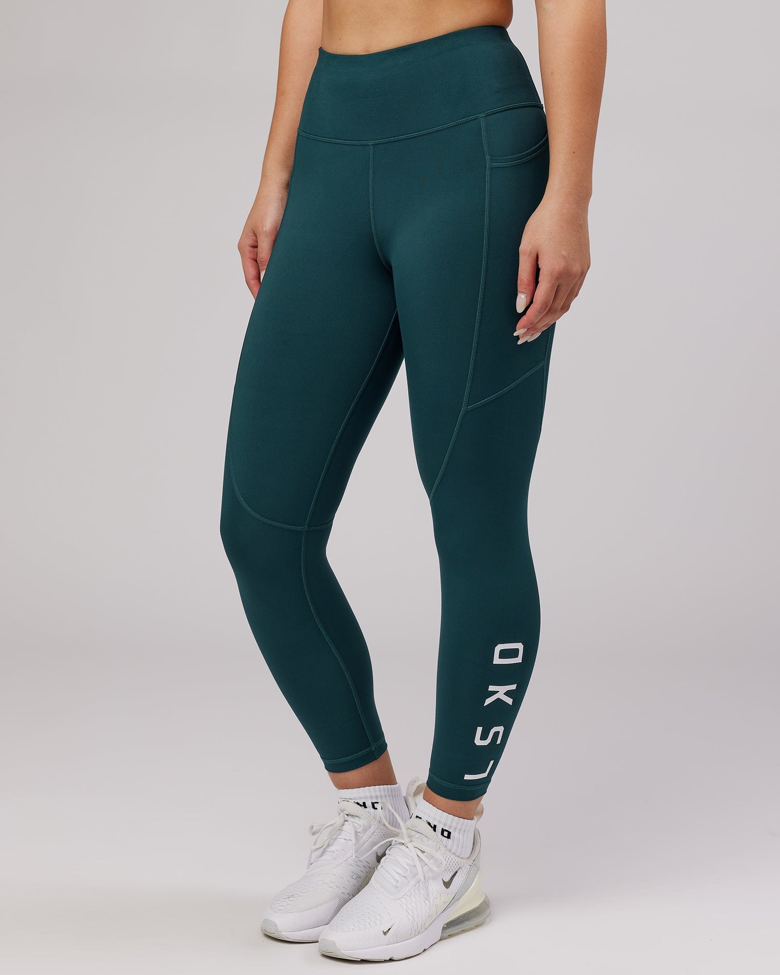 Model wearing Rep 7/8 Length Tight - Deep Teal
