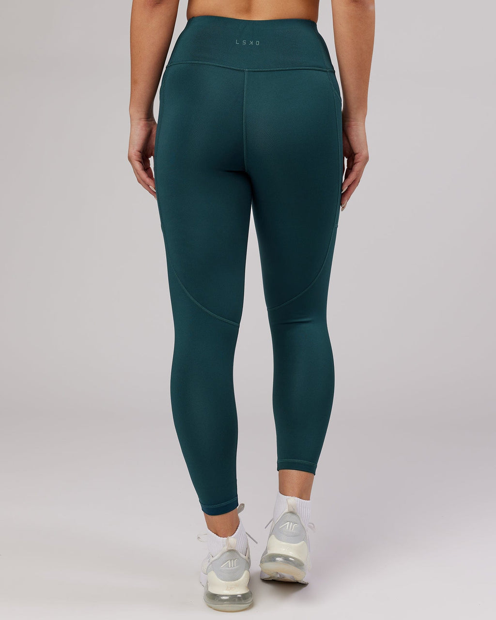 Model wearing Rep 7/8 Length Tight - Deep Teal