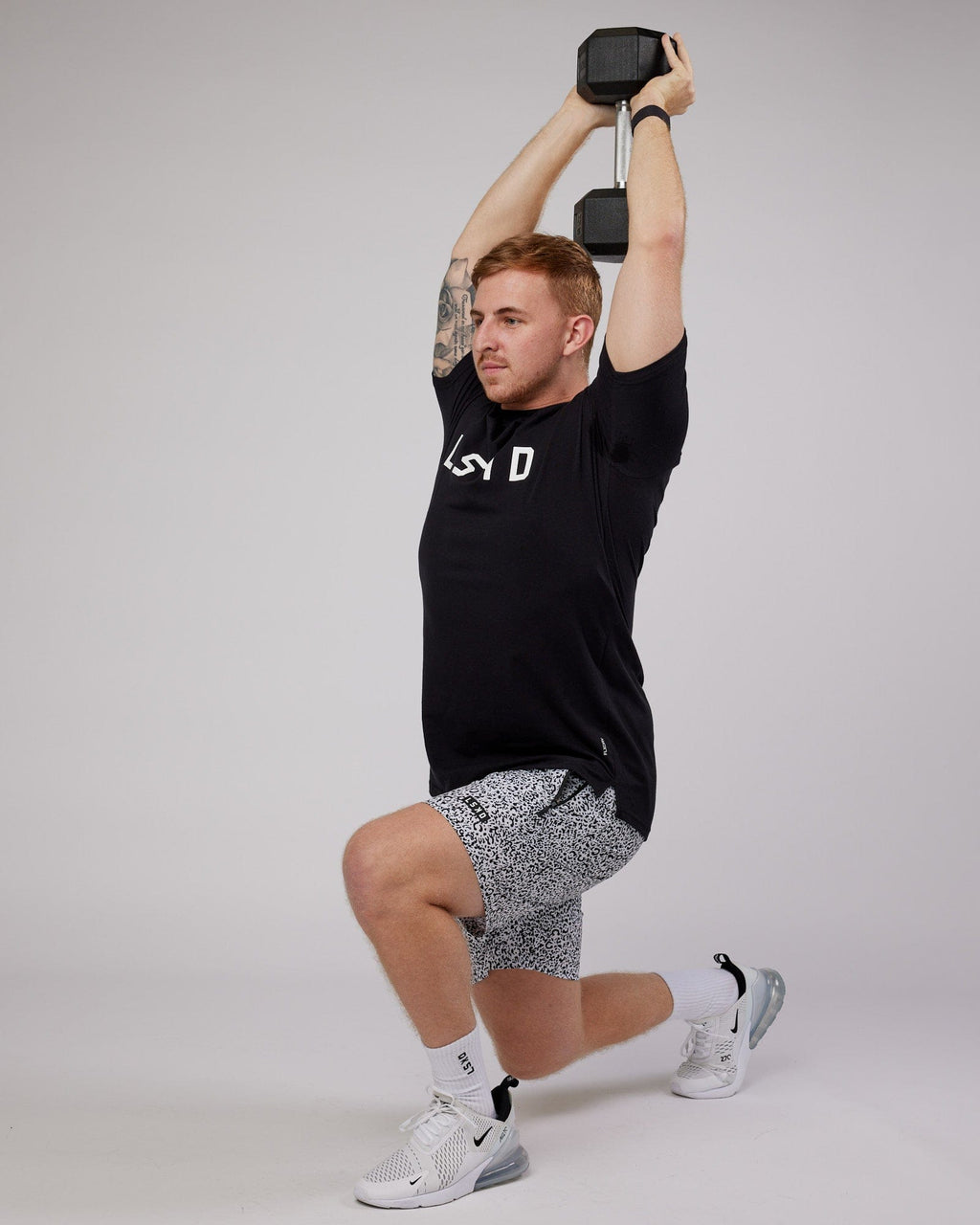 Model wearing Rep 7" Performance Short - Spotty White-Black