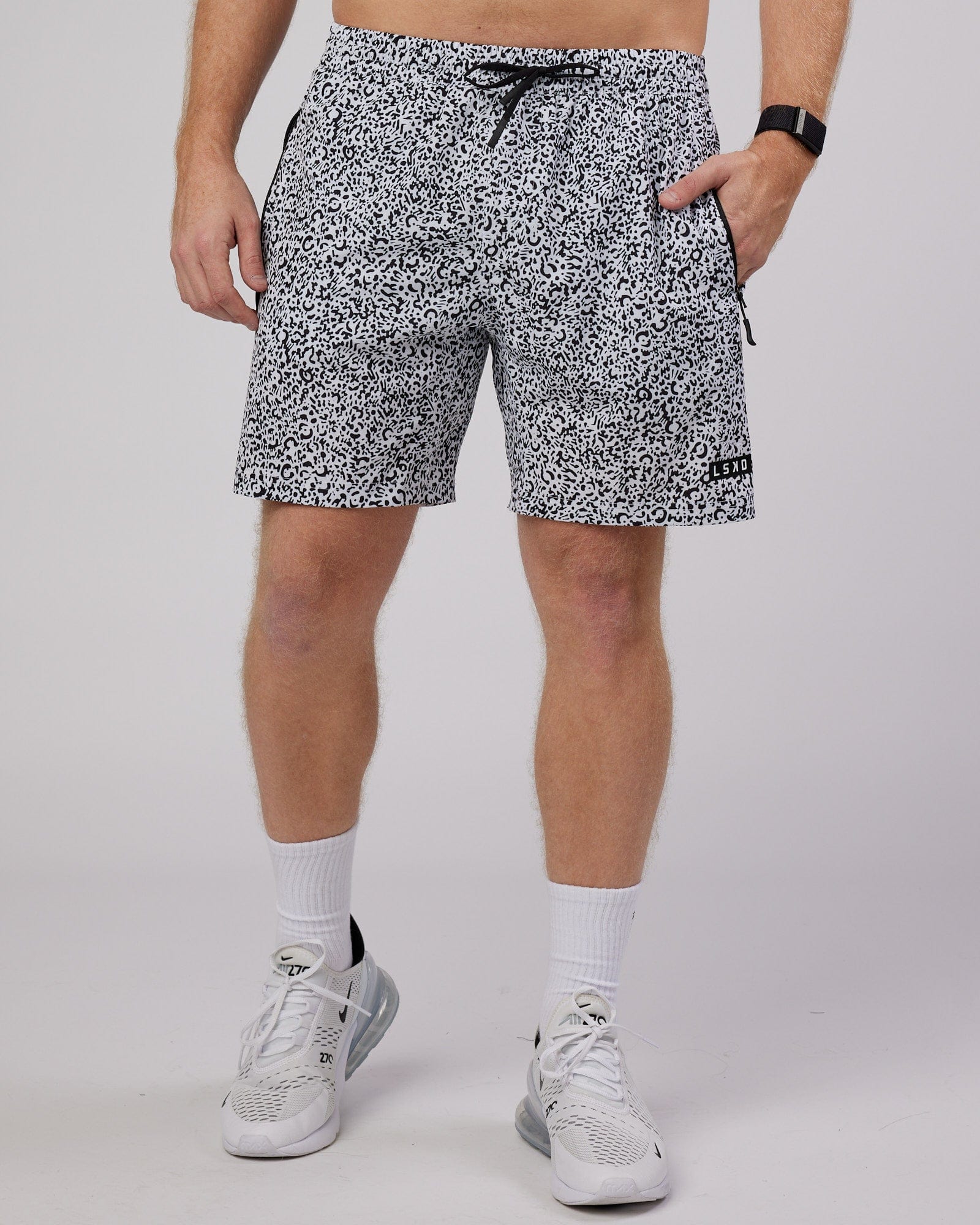 Model wearing Rep 7" Performance Short - Spotty White-Black