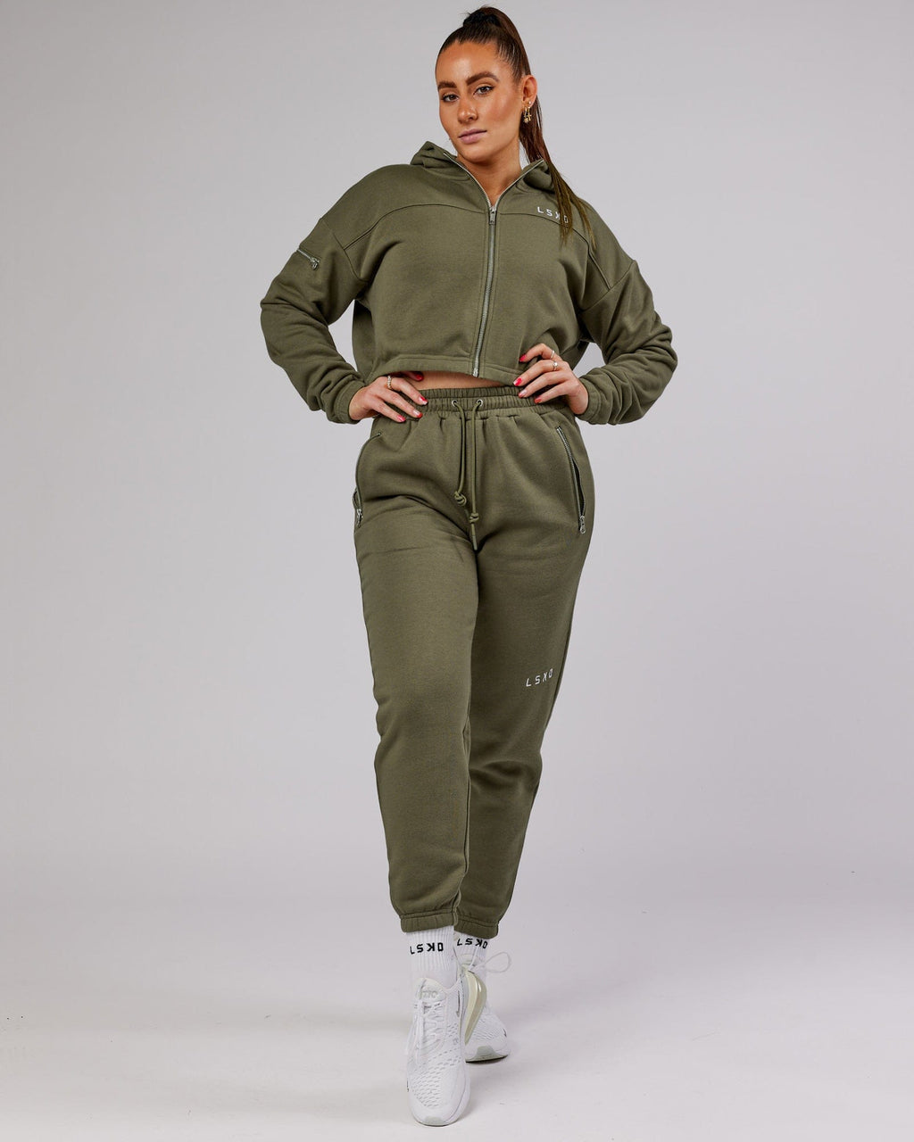 Model wearing Becca Track Pant - Olive Fade