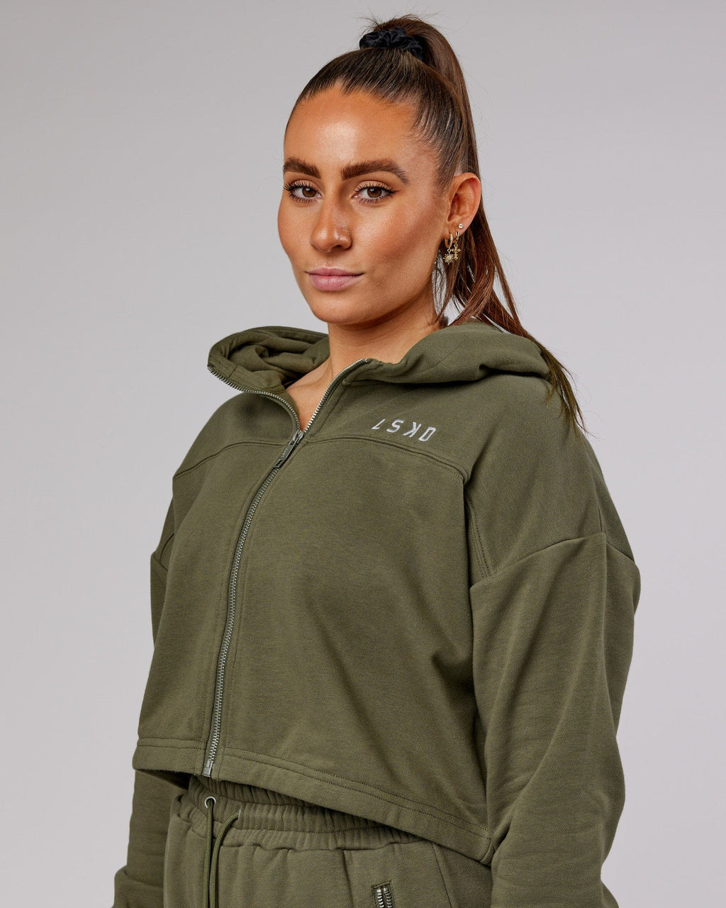 Model wearing Bridge Zip Through Hoodie - Olive Fade