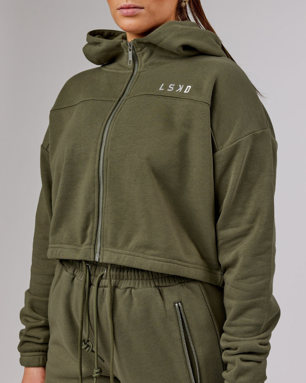 Model wearing Bridge Zip Through Hoodie - Olive Fade