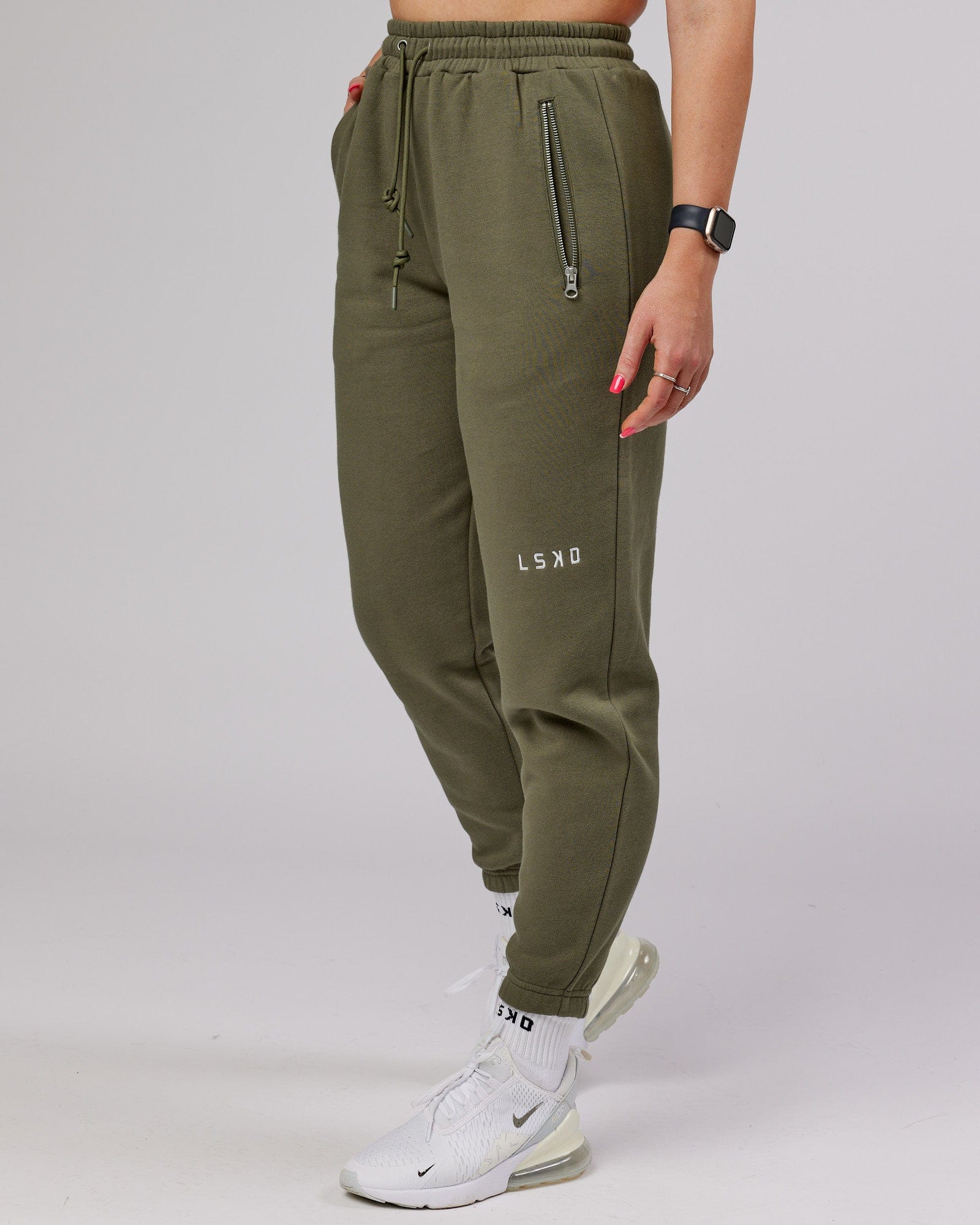 Model wearing Becca Track Pant - Olive Fade