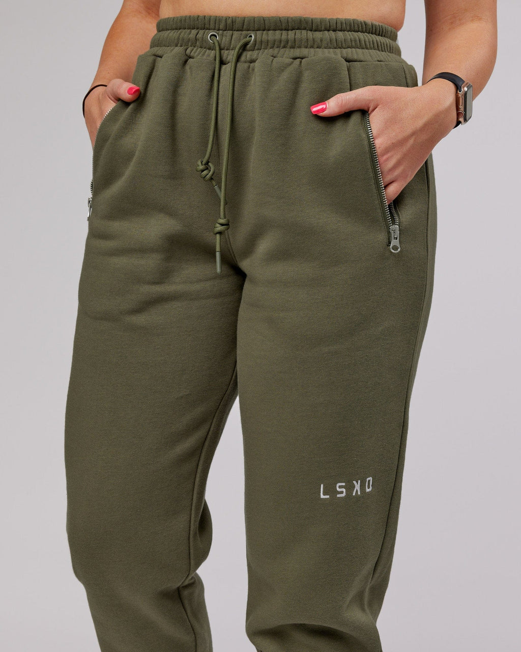 Model wearing Becca Track Pant - Olive Fade