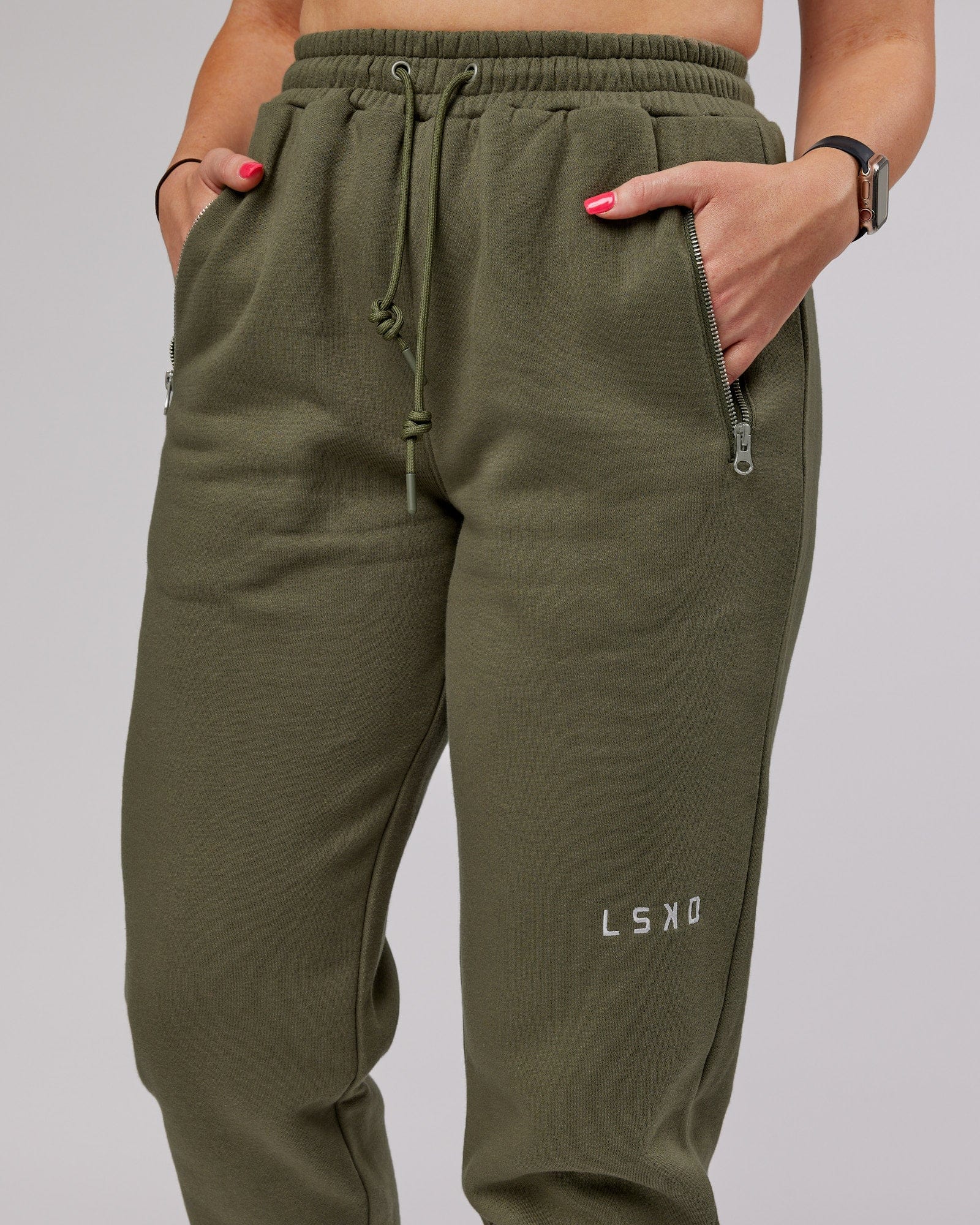 Model wearing Becca Track Pant - Olive Fade