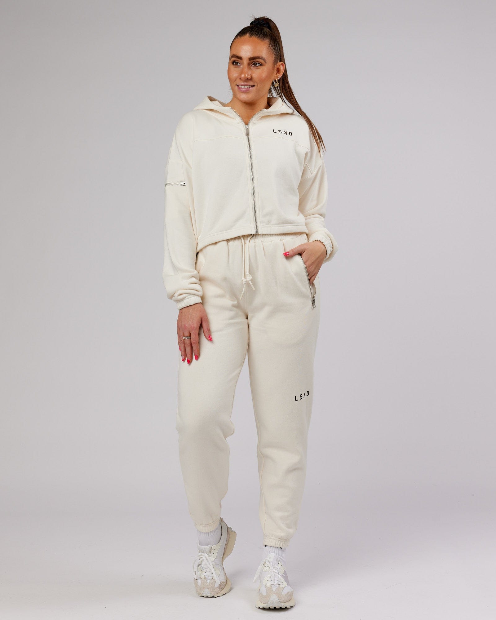Model wearing Bridge Zip Through Hoodie - Cream