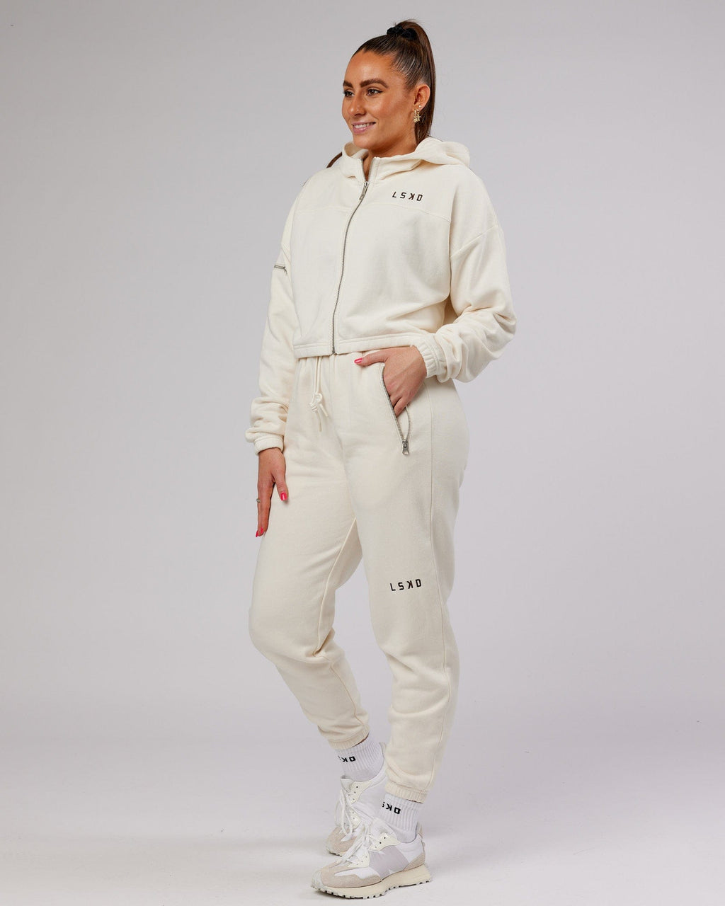 Model wearing Bridge Zip Through Hoodie - Cream