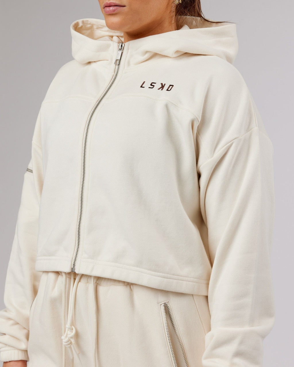 Model wearing Bridge Zip Through Hoodie - Cream