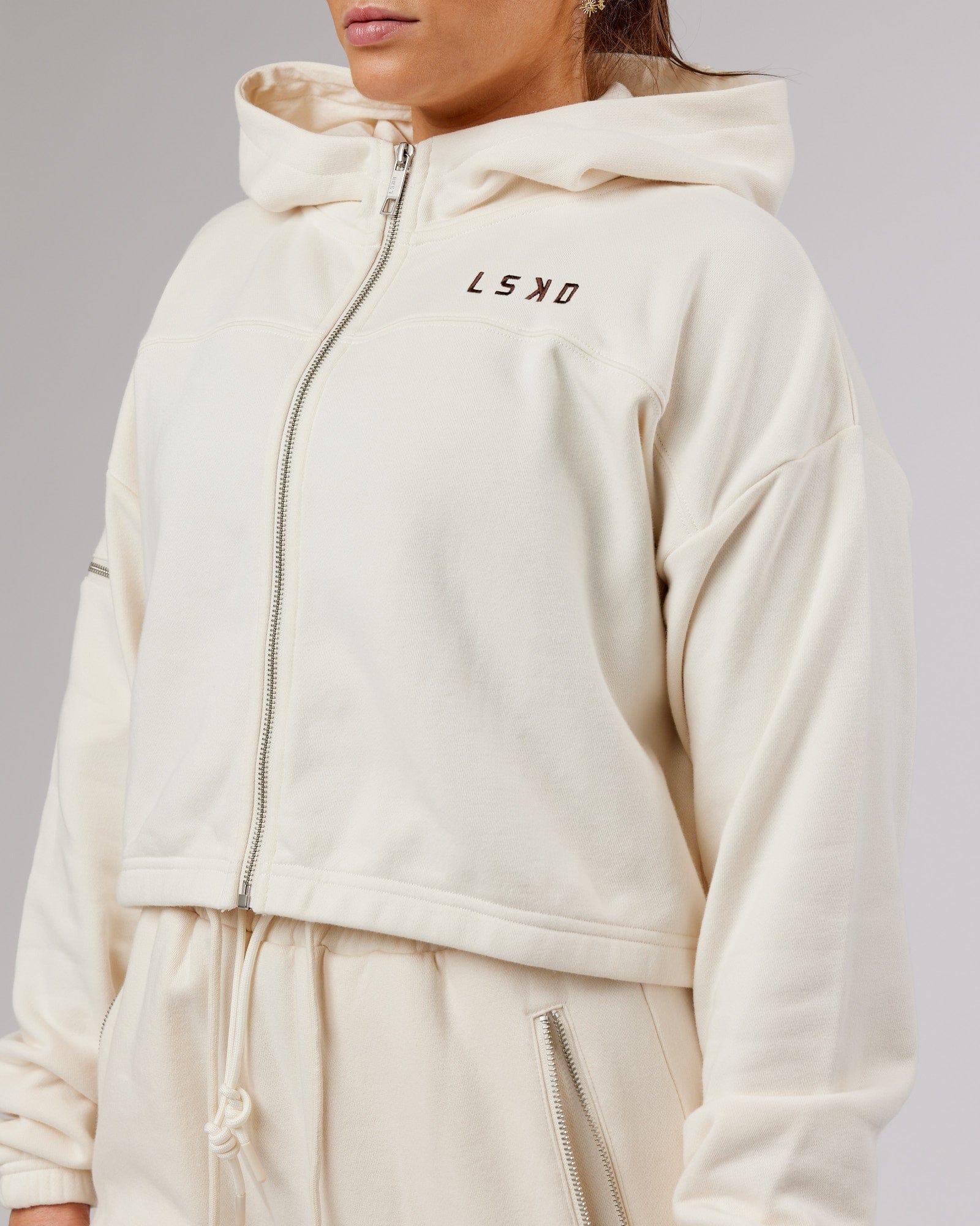 Model wearing Bridge Zip Through Hoodie - Cream