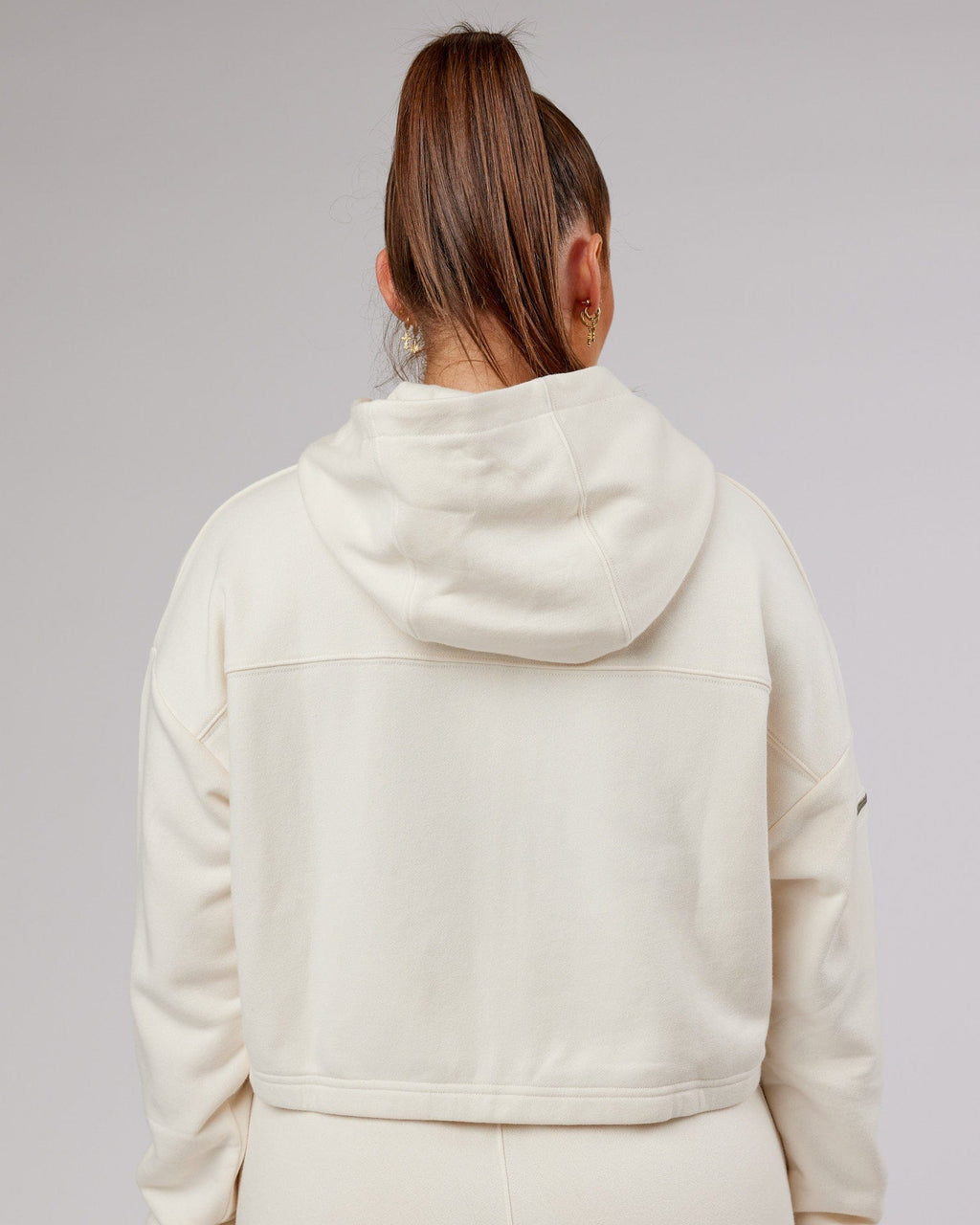 Model wearing Bridge Zip Through Hoodie - Cream