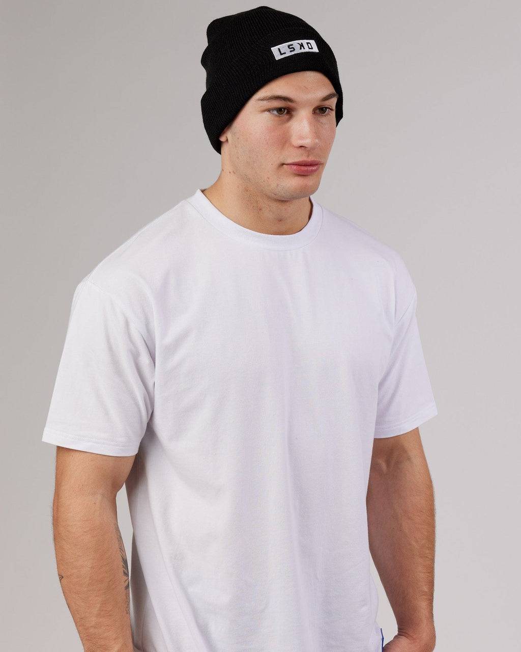 Model wearing Cornerstone Beanie - Black
