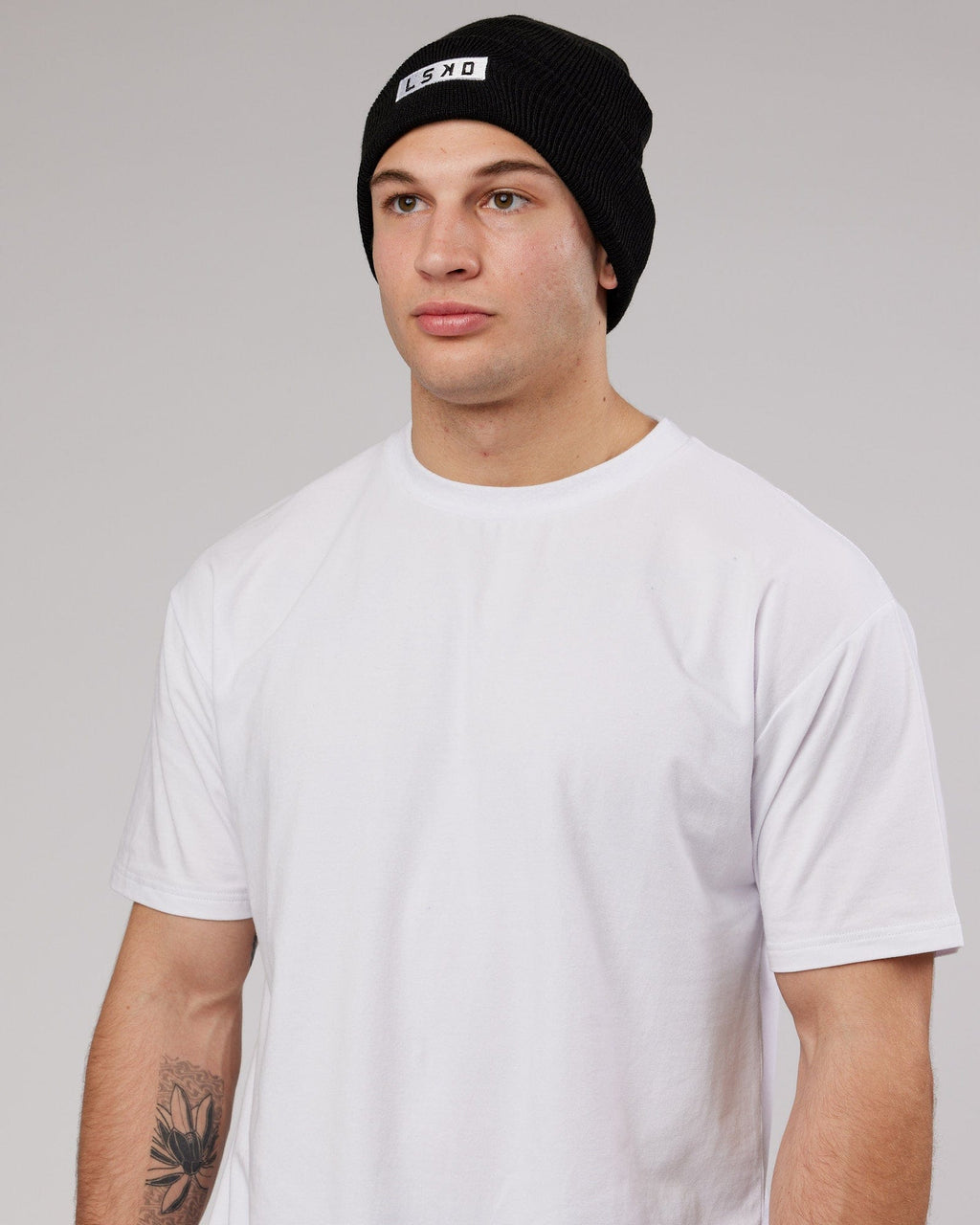Model wearing Cornerstone Beanie - Black