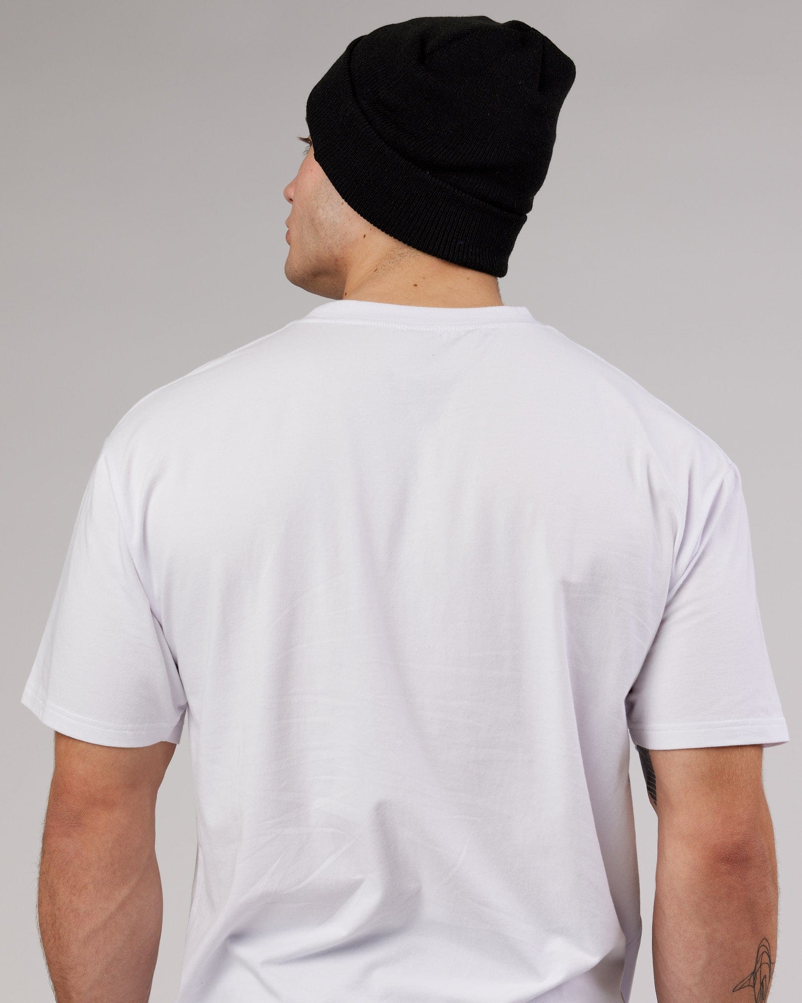 Model wearing Cornerstone Beanie - Black