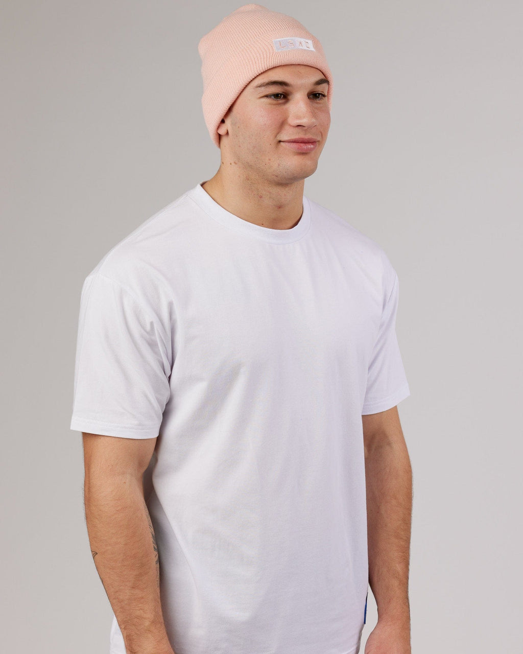 Model wearing Cornerstone Beanie - Pink-White