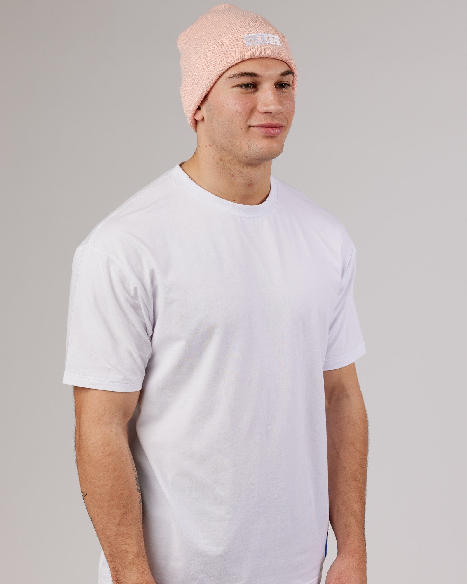 Model wearing Cornerstone Beanie - Pink-White