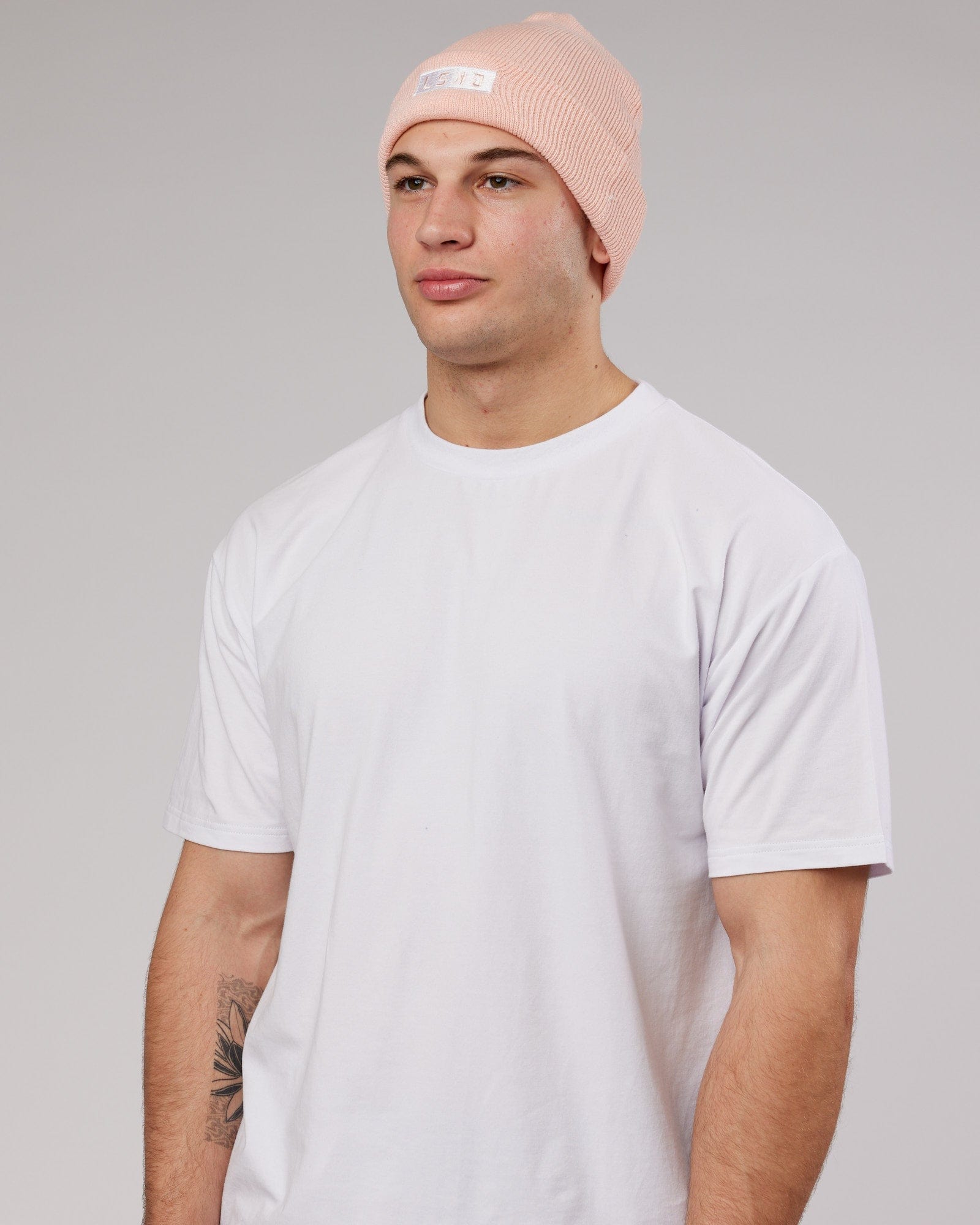 Model wearing Cornerstone Beanie - Pink-White