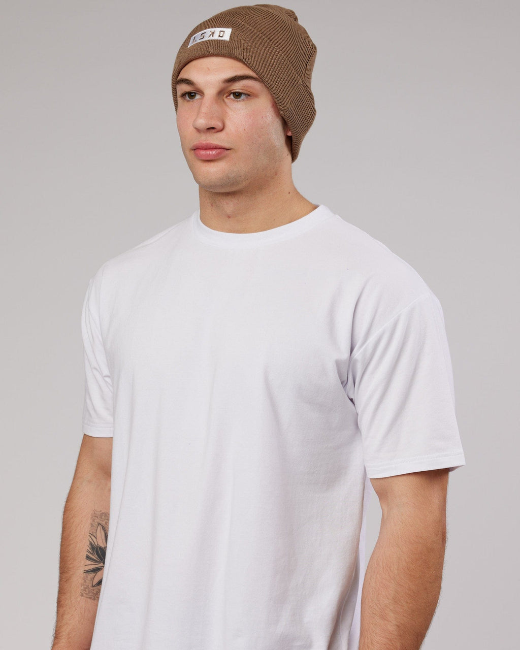 Model wearing Cornerstone Beanie - Fossil