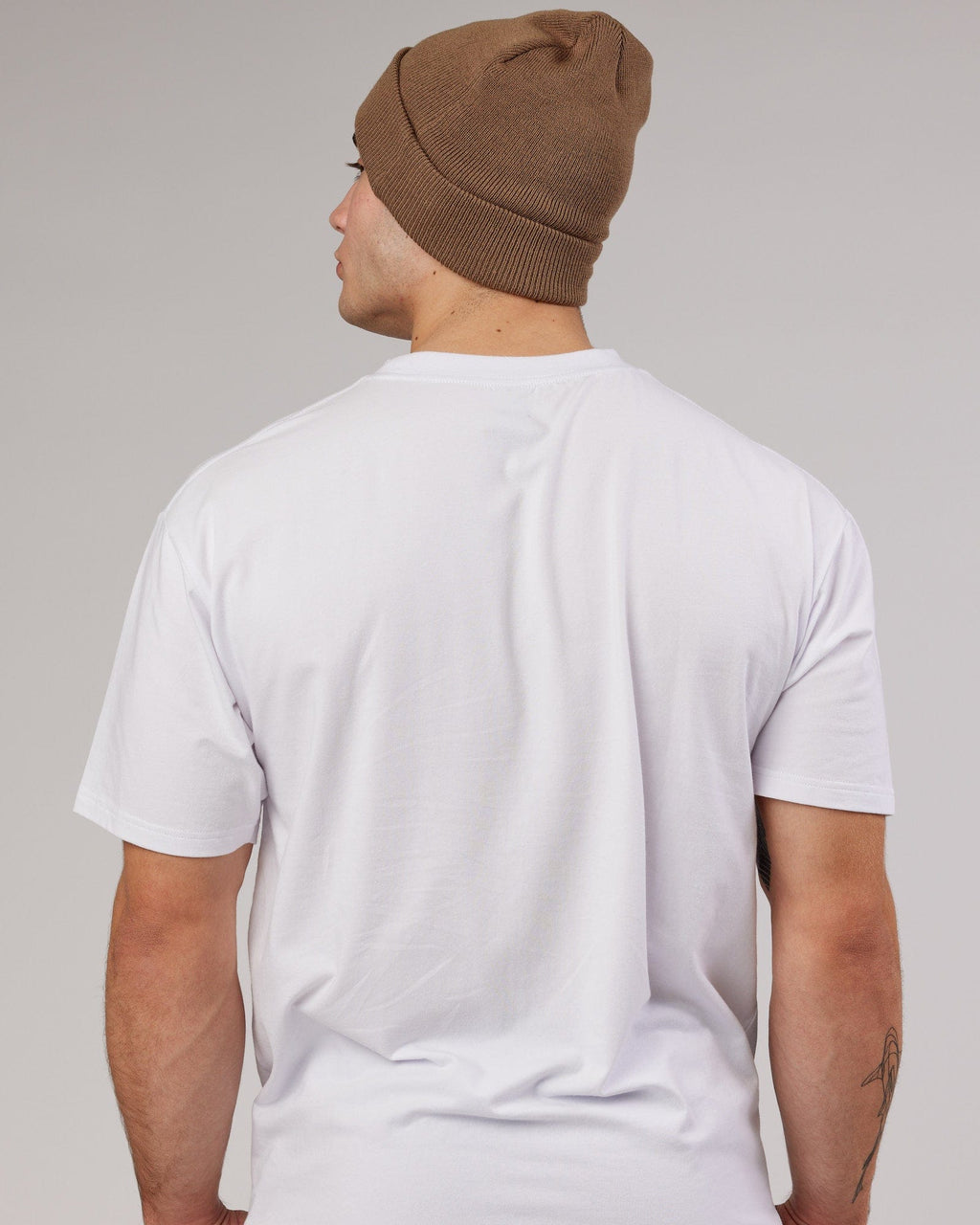 Model wearing Cornerstone Beanie - Fossil