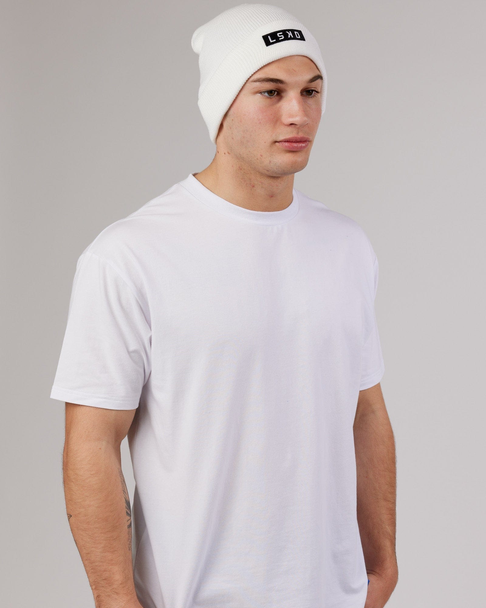 Model wearing Cornerstone Beanie - White