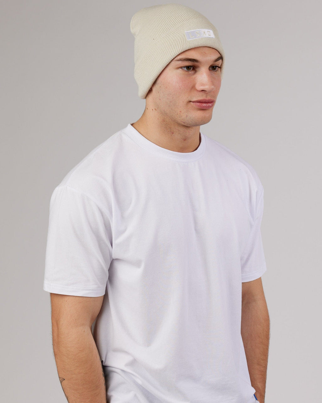 Model wearing Cornerstone Beanie - Bone
