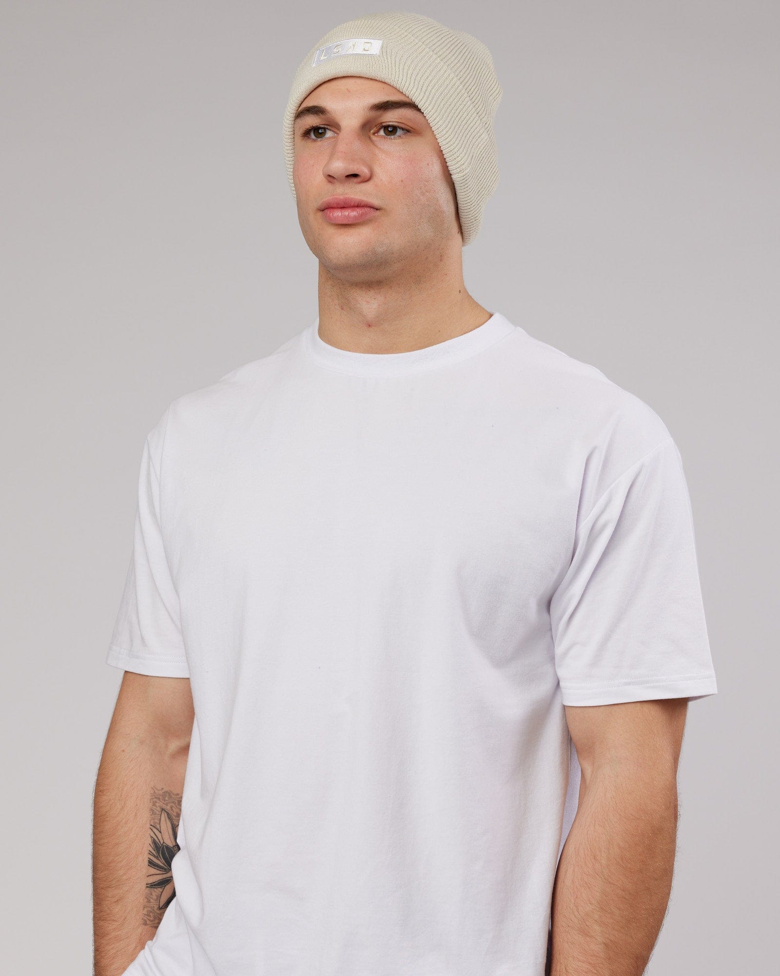 Model wearing Cornerstone Beanie - Bone