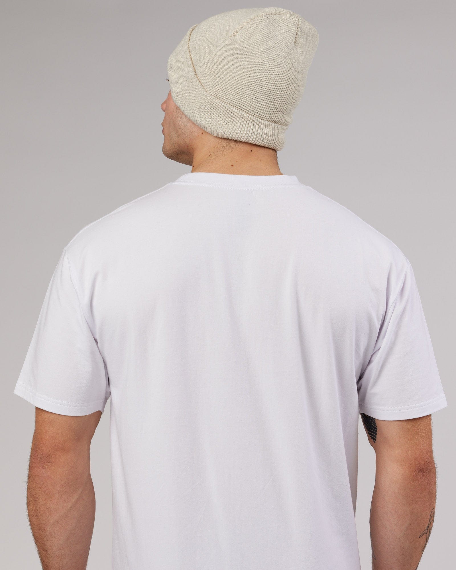 Model wearing Cornerstone Beanie - Bone