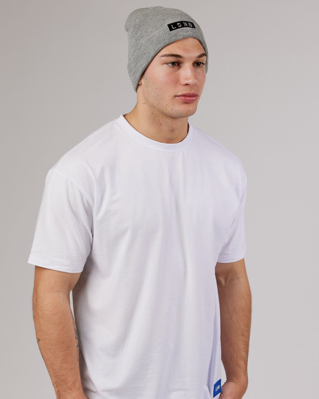 Model wearing Cornerstone Beanie - Lt Grey Marl