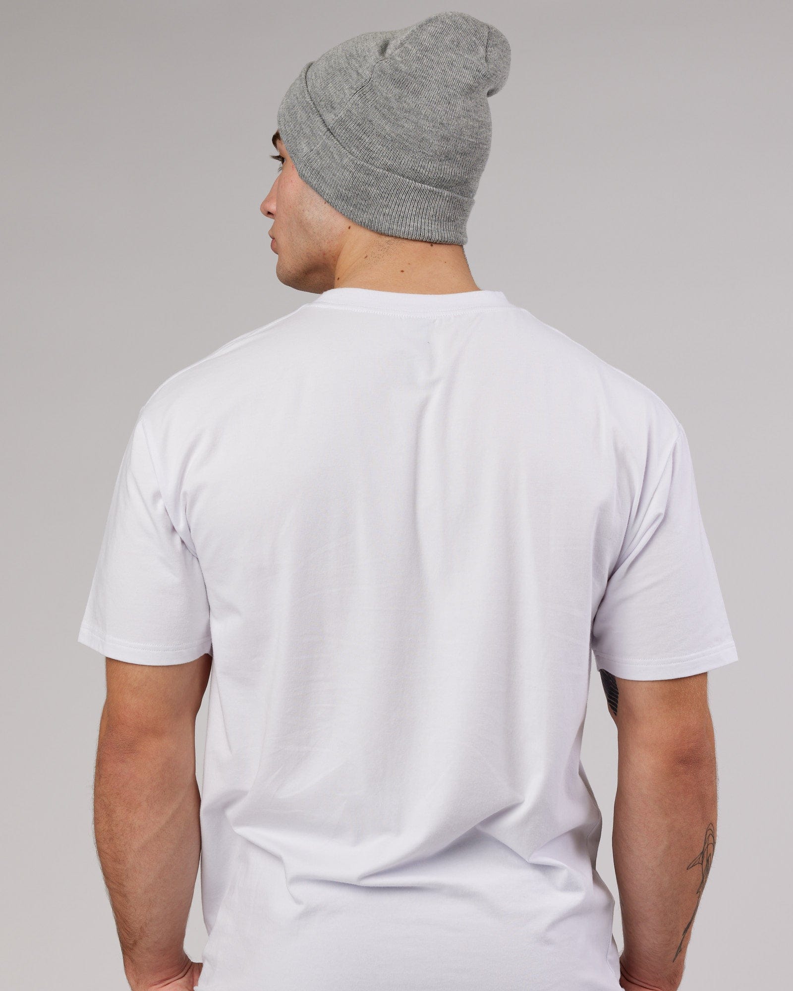 Model wearing Cornerstone Beanie - Lt Grey Marl